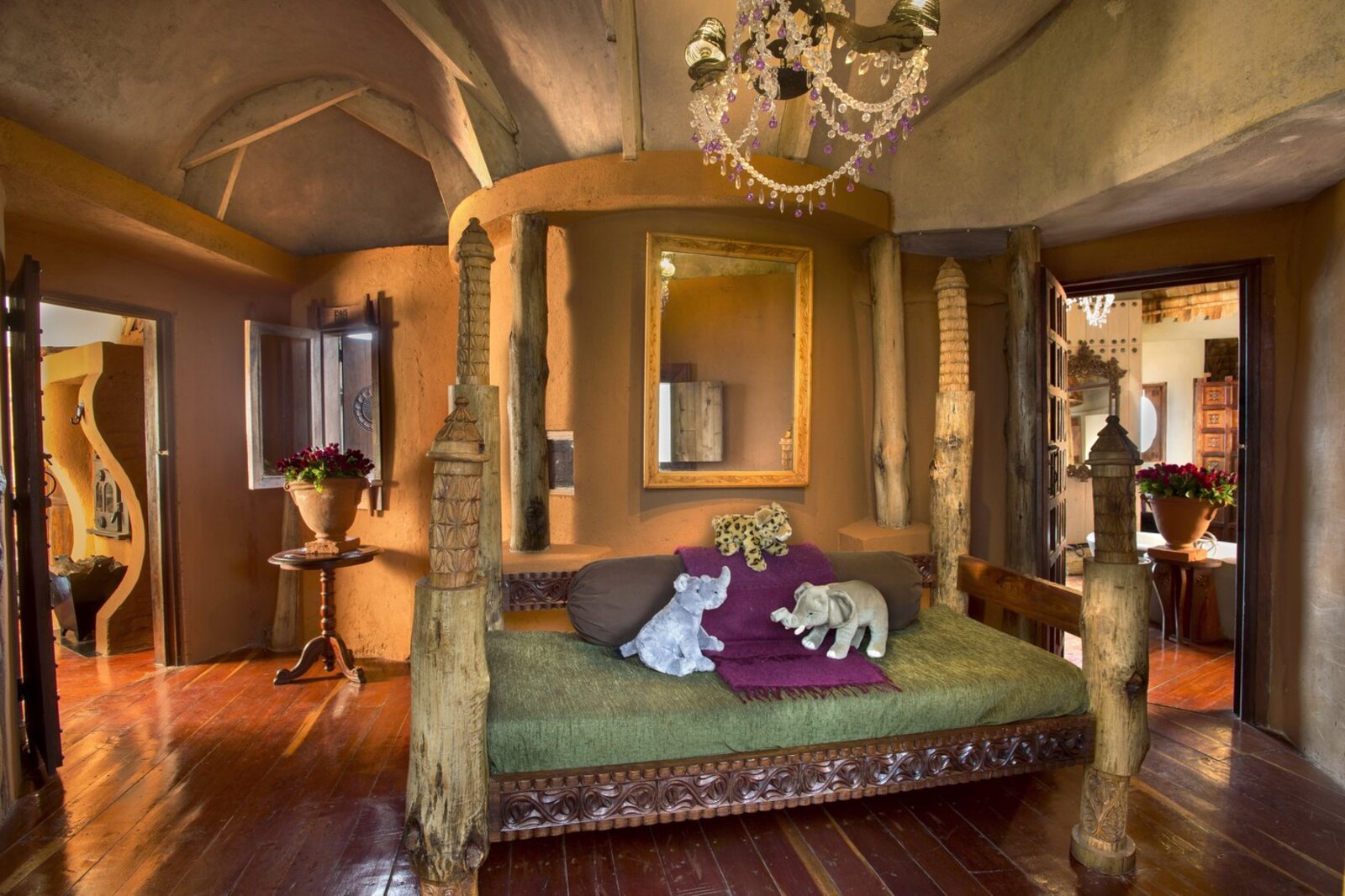 Ngorongoro Crater Lodge opulent stilted suite with chandelier and hand-crafted furnishings
