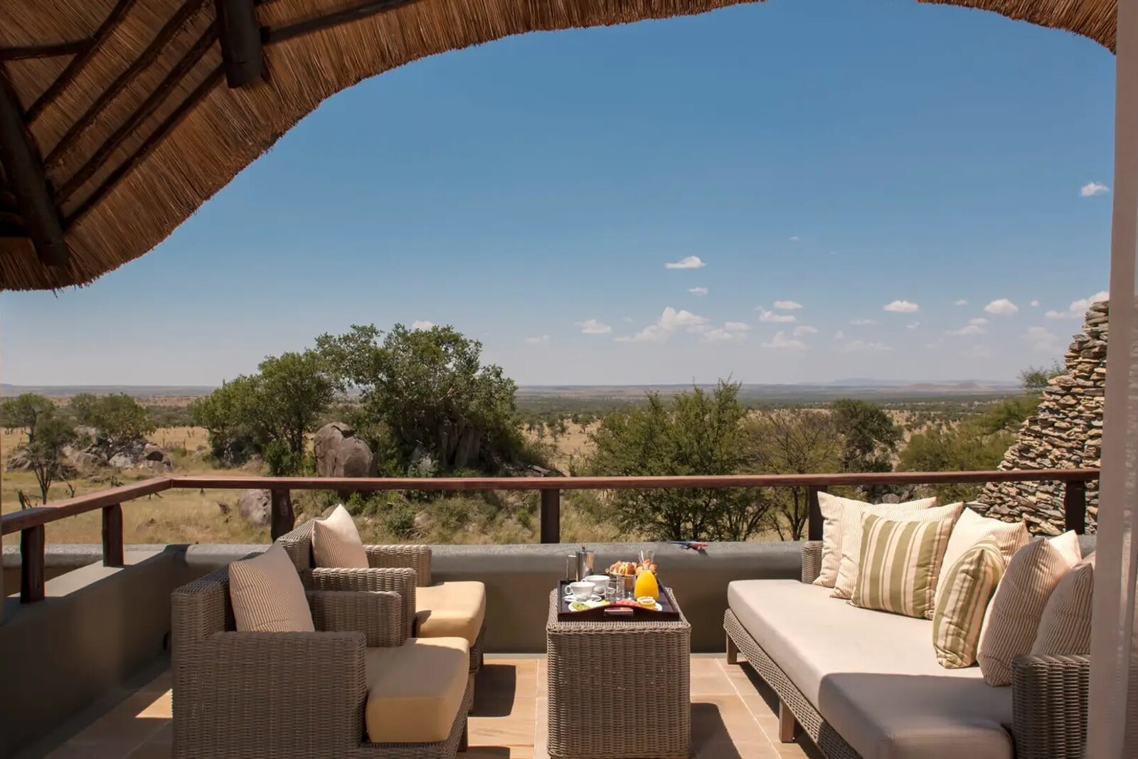 Four Seasons Safari Lodge Serengeti thatched deck lounge with views over the endless plains