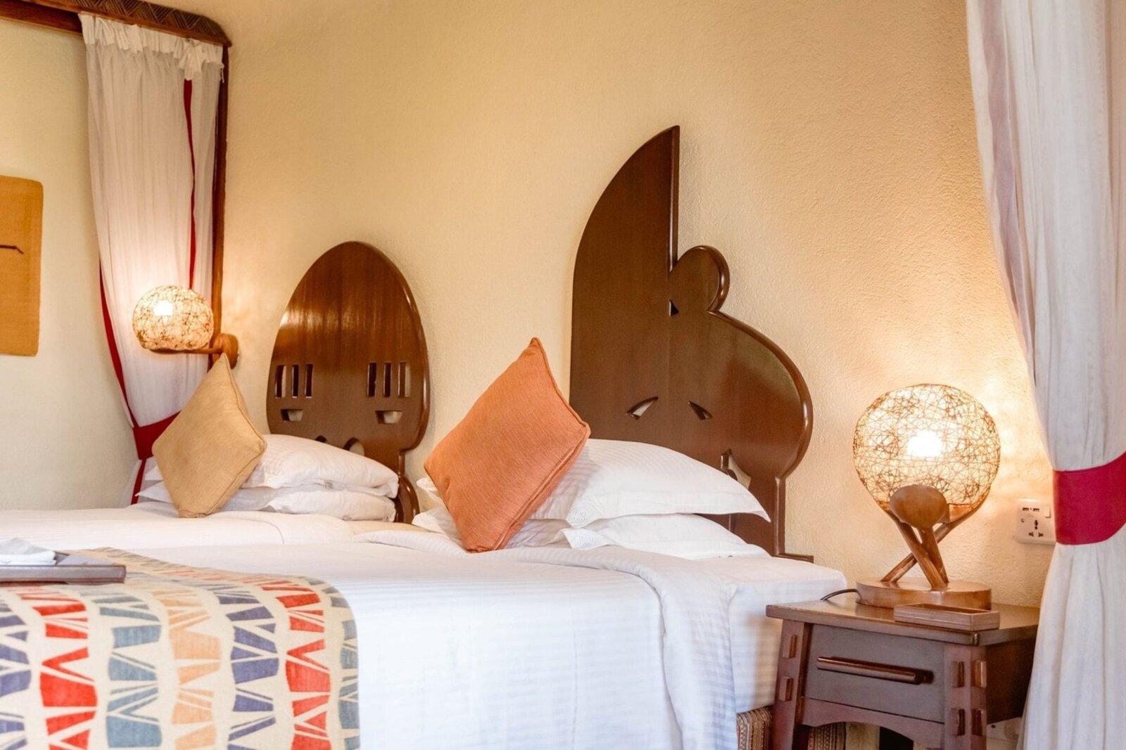 Ngorongoro Serena Safari Lodge family room with hand-carved twin headboards