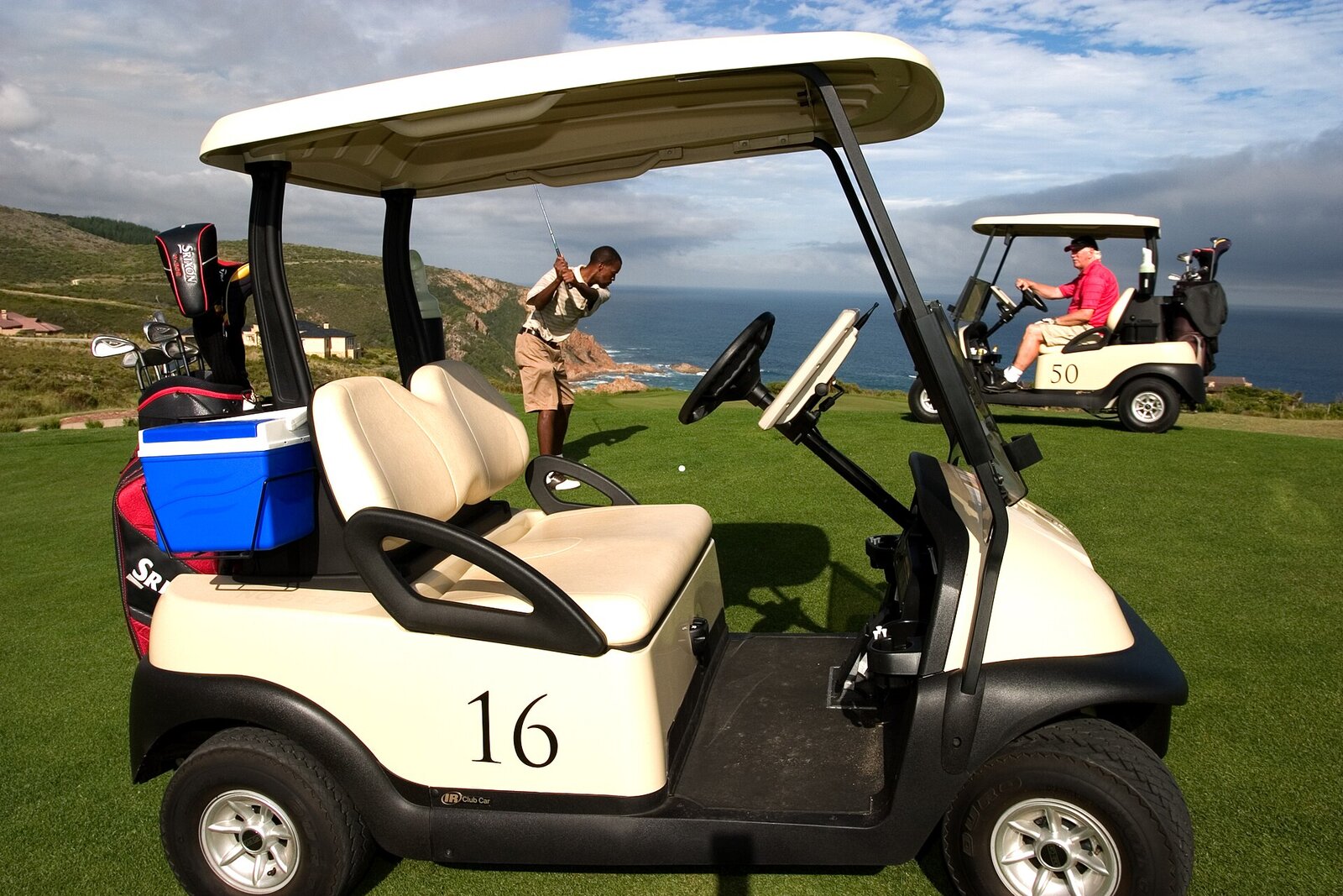 Golf cart on a fairway near the coast at Fancourt