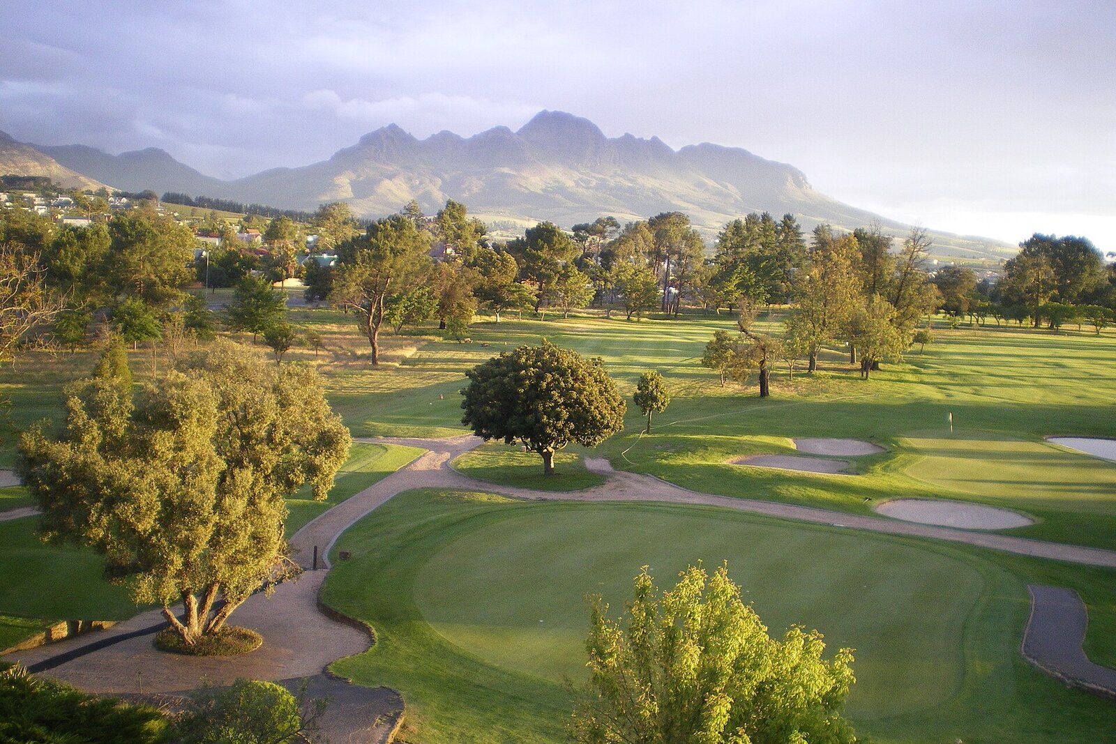 Championship golf course beneath mountains on the Garden Route