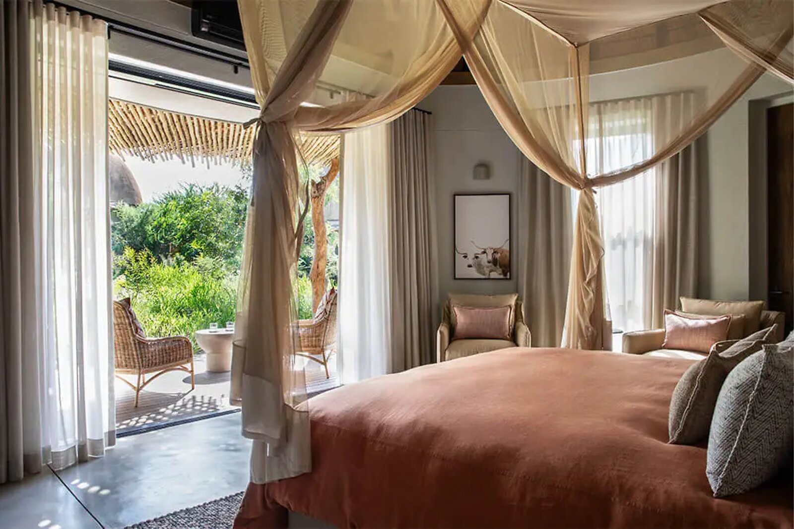 Indlu suite with river and bush views through floor-to-ceiling glass at Fifty-Five Mjejane