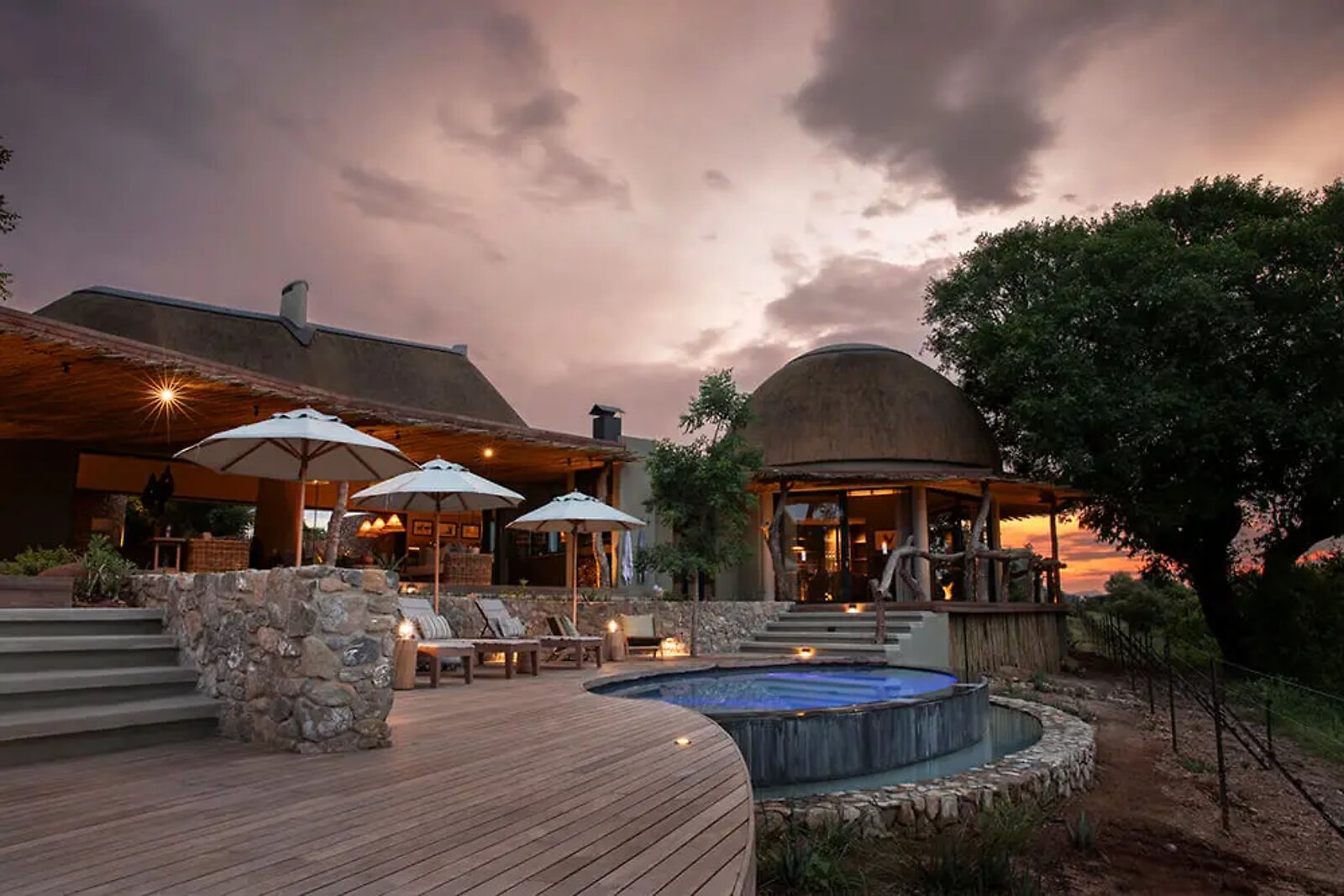 Sunset over the deck and infinity pool at Fifty-Five Mjejane above the Crocodile River