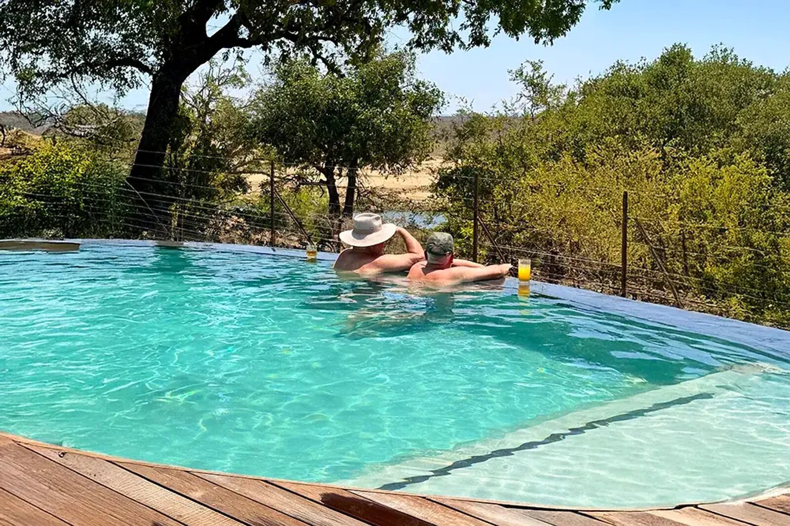 Infinity pool over the river with a champagne setup at Fifty-Five Mjejane