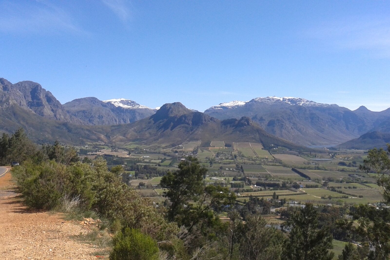 Franschhoek vineyards and estate with dramatic mountain backdrop
