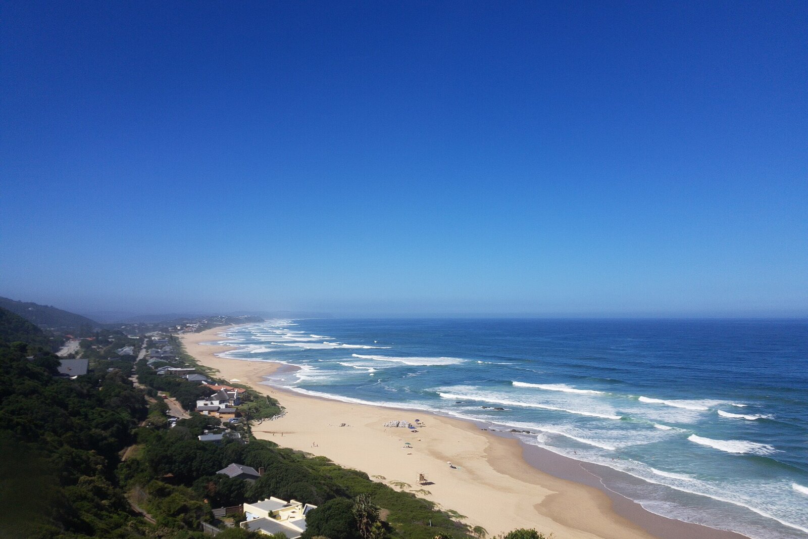 A family enjoying a safe golden swimming beach on the Garden Route