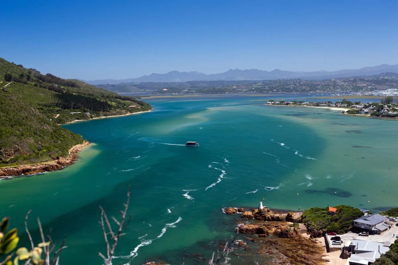 The calm lagoon and forested shores along the Garden Route