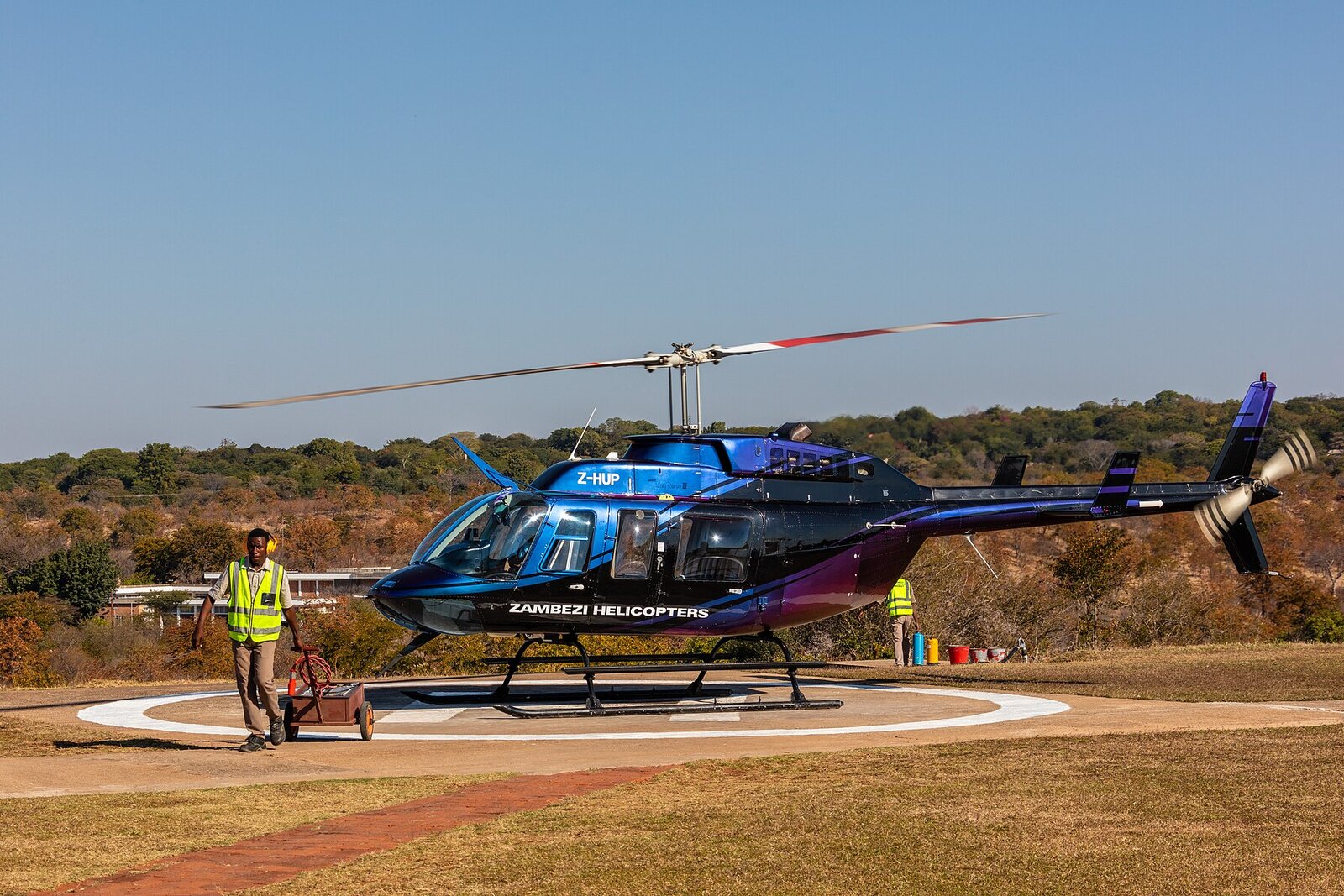 A helicopter landed in remote wilderness for a private safari picnic