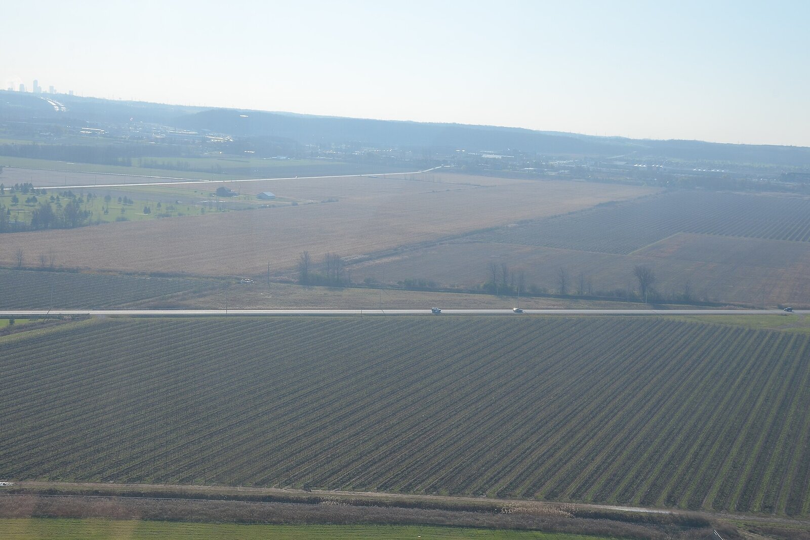Aerial view of Cape Winelands vineyards and mountains from a helicopter