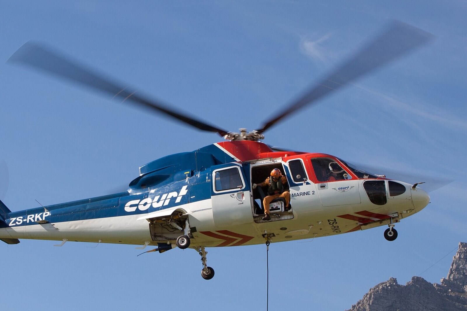 Helicopter landing on the lawn of a vineyard wine estate