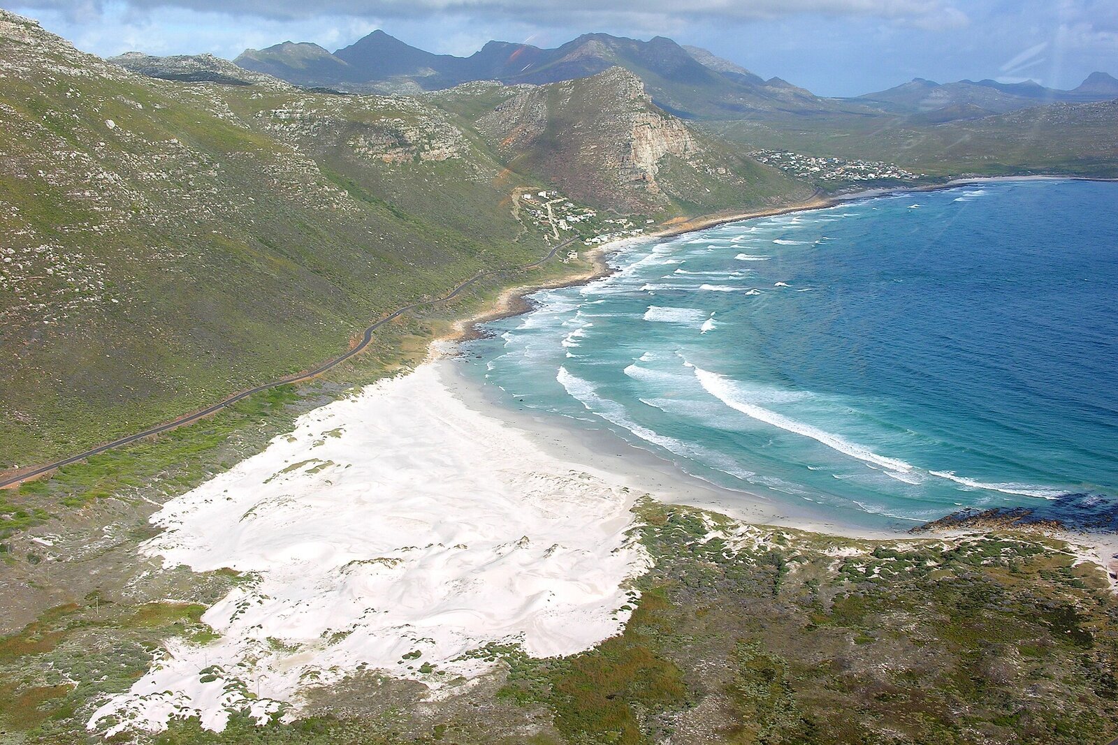 Helicopter flying over the Cape coastline at sunset