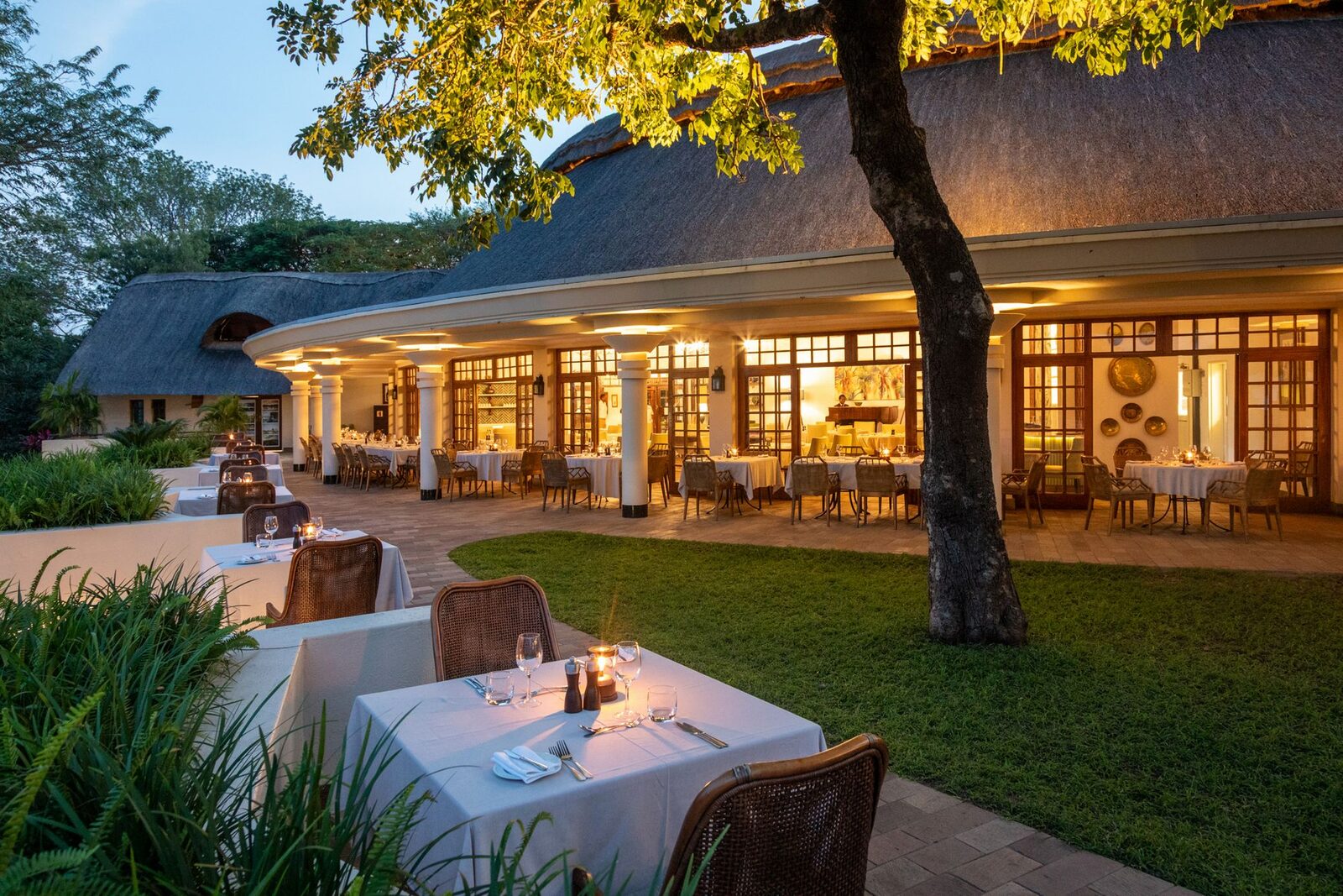 Candlelit outdoor dining on the lawn at the Palm Restaurant, Ilala Lodge
