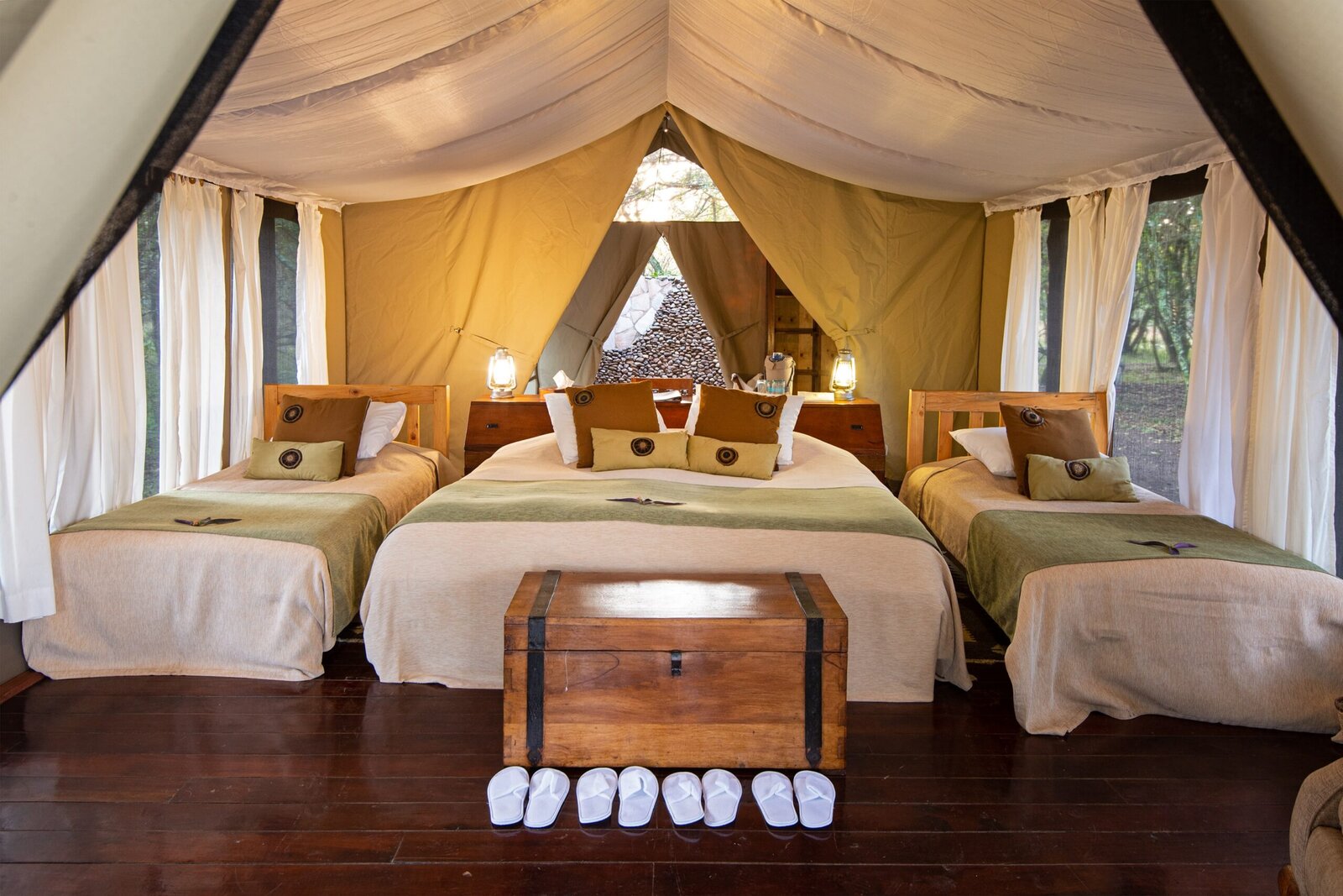 Karen Blixen Camp luxury tent interior with Persian rugs and Out of Africa decor