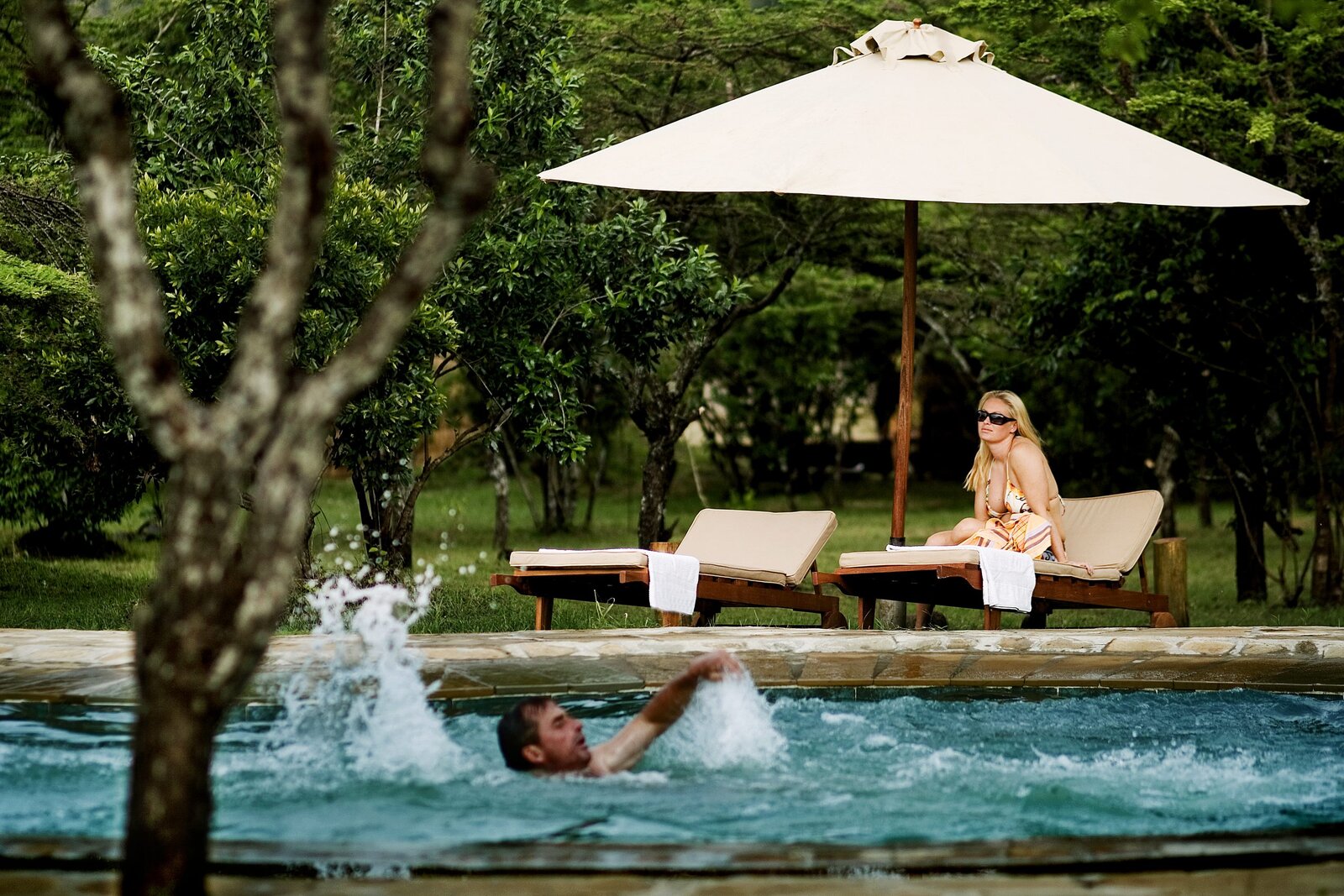 Organic-shaped swimming pool at Karen Blixen Camp