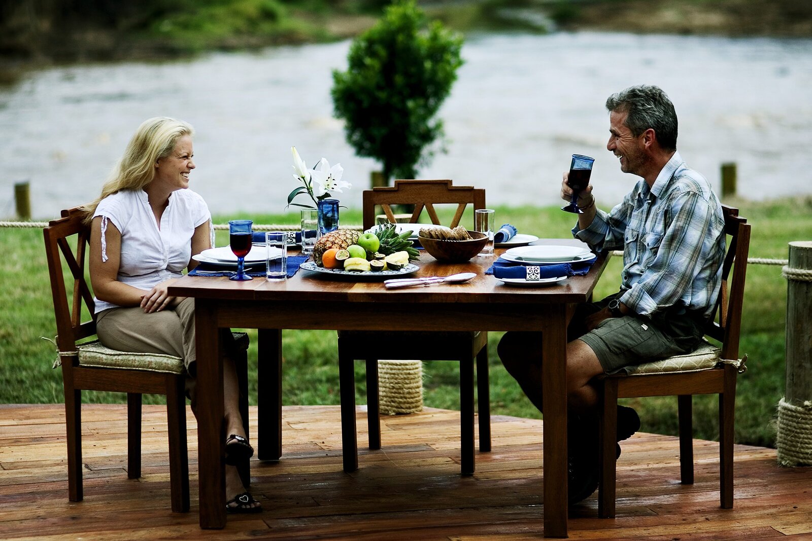 Riverside dining deck over the Mara River at Karen Blixen Camp