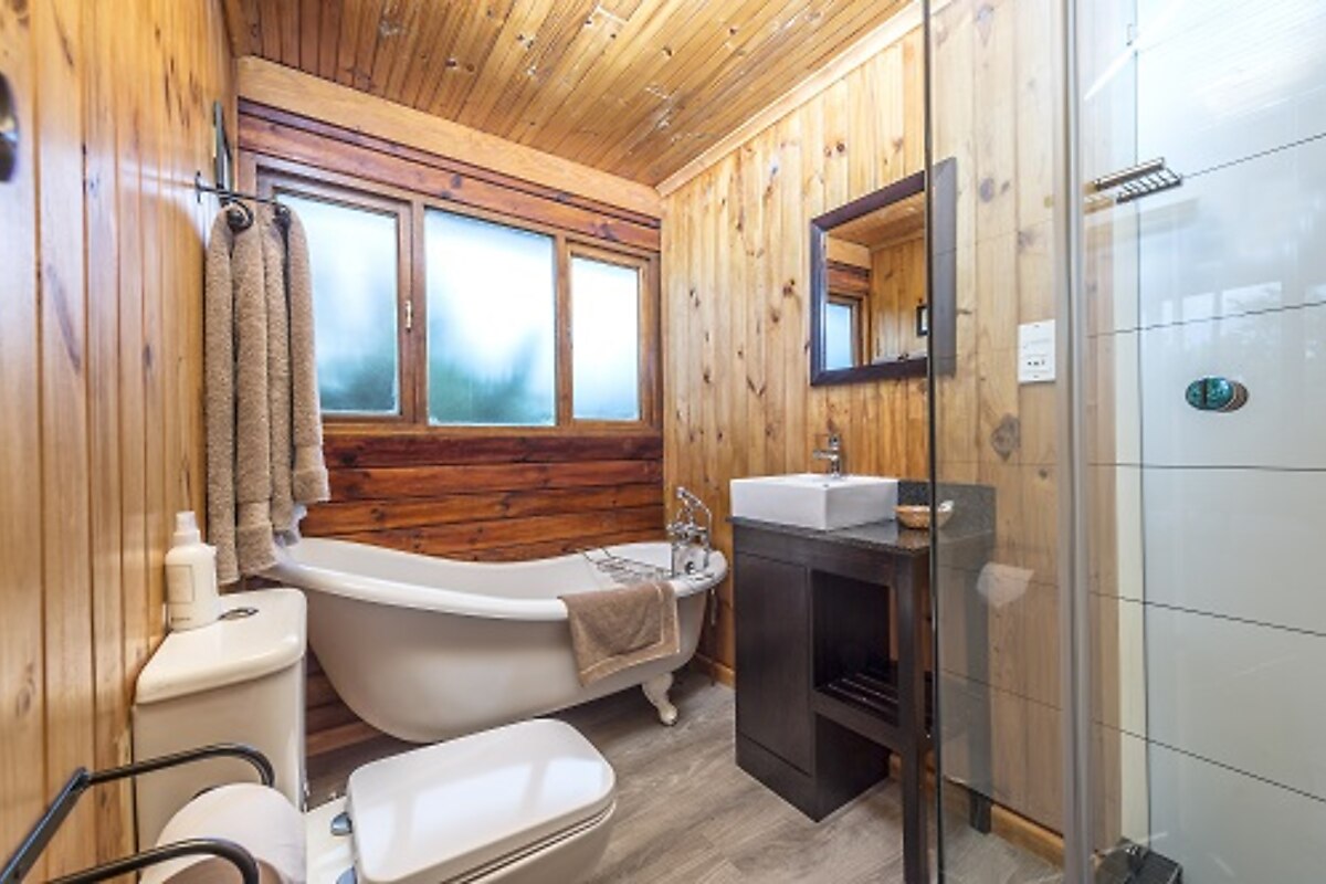 A luxury bathroom with freestanding tub at Kariega