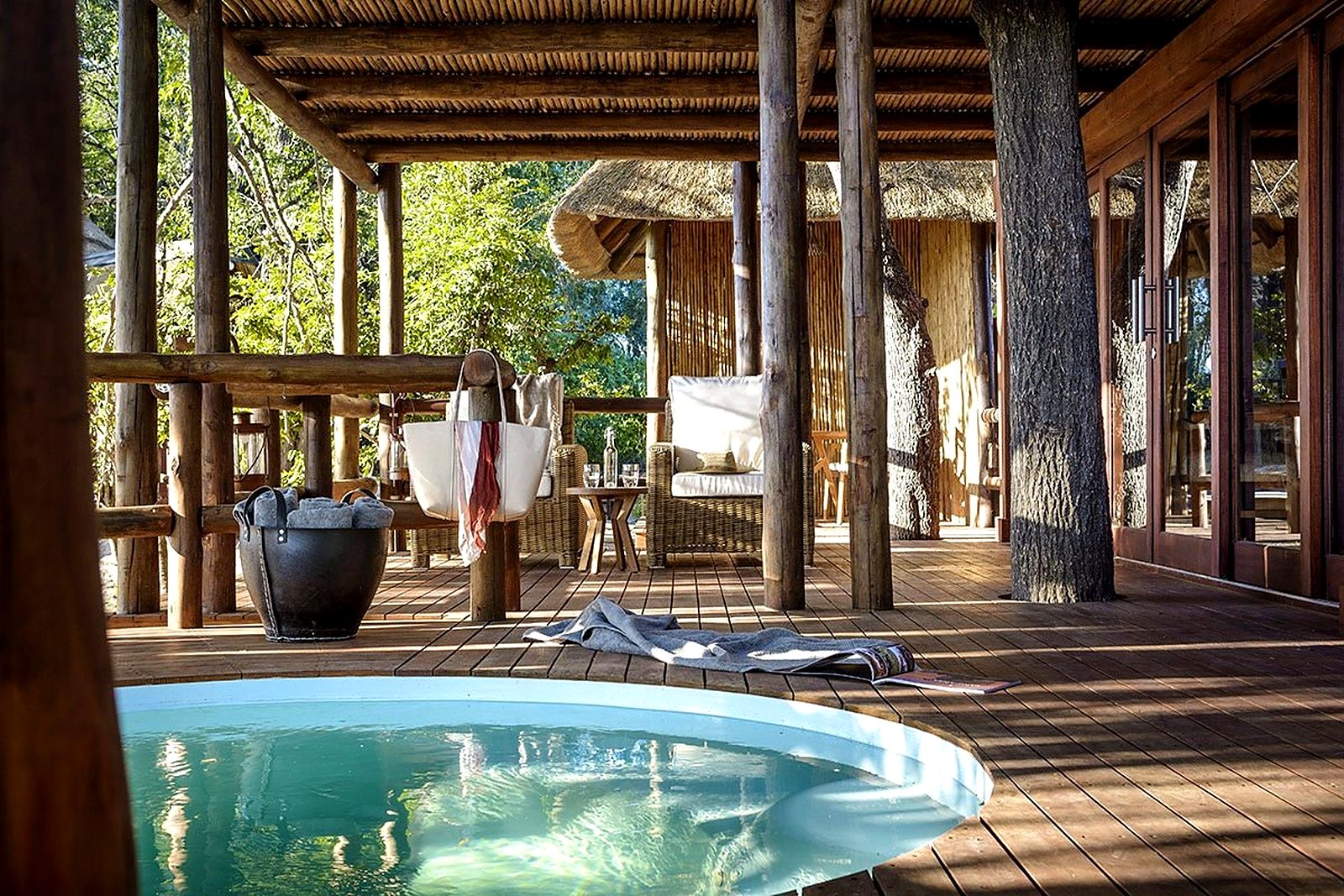 Machaba Camp riverside deck and dining under the trees, Khwai