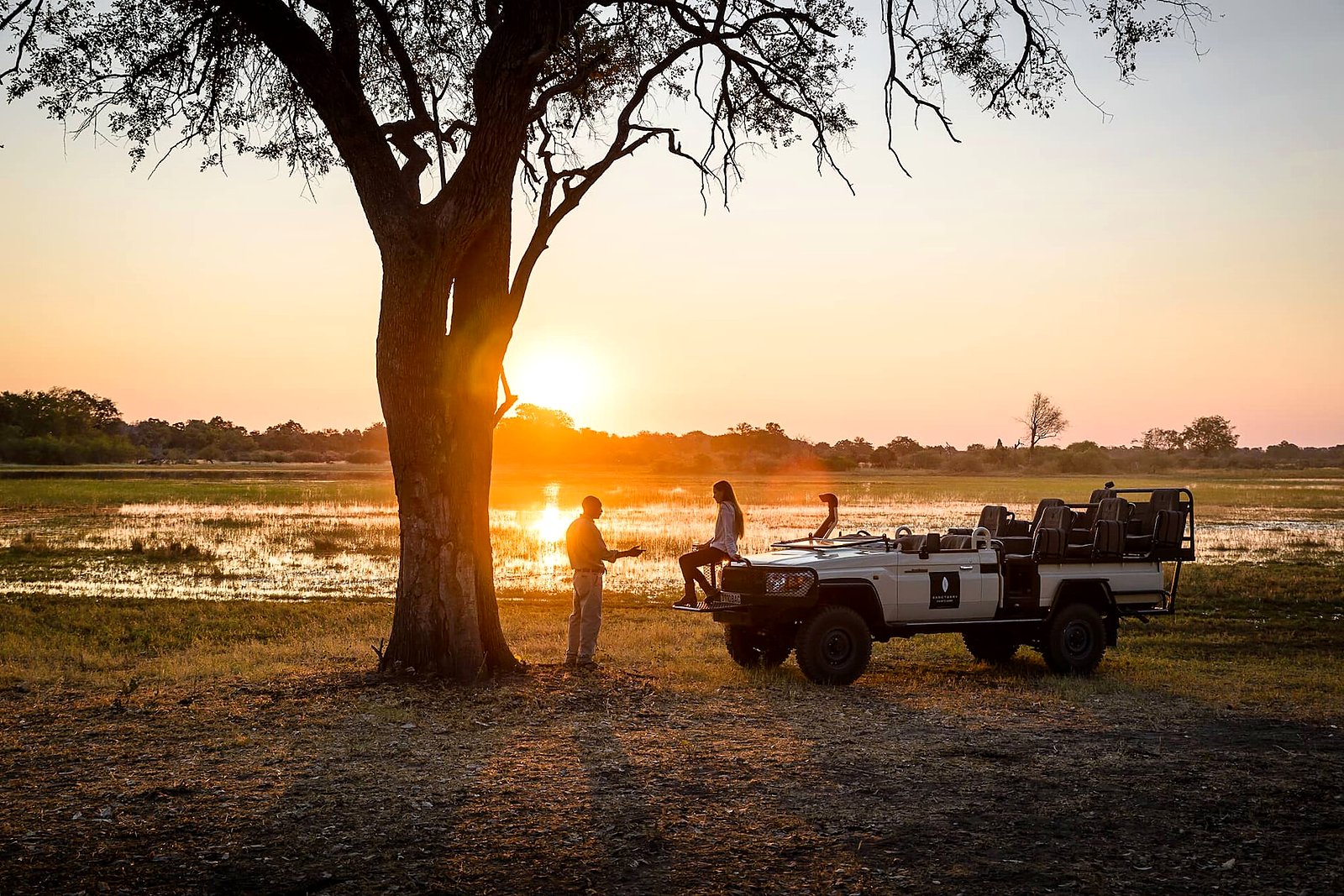 Machaba Camp lounge with views over the Khwai floodplain at golden hour