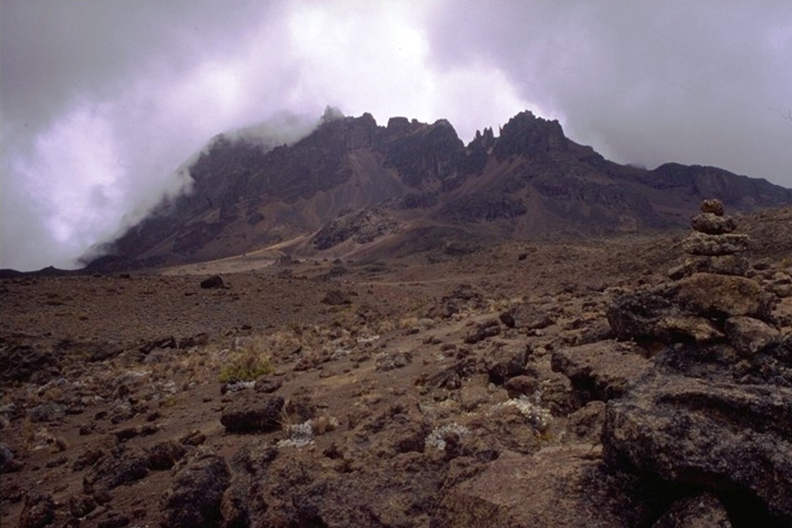 The jagged Mawenzi peak of Kilimanjaro wreathed in cloud