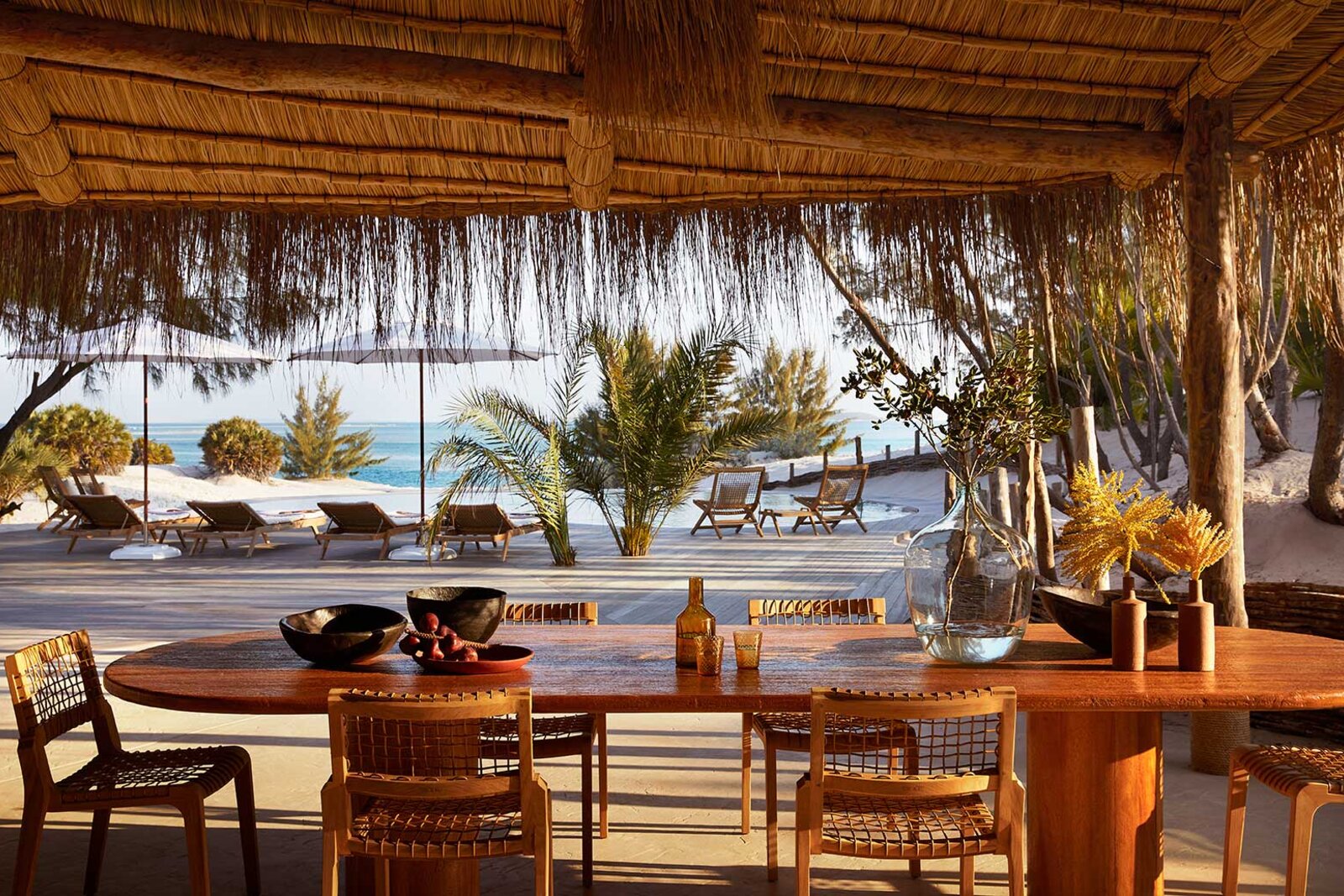 An open-air dining terrace at Kisawa Sanctuary overlooking the Indian Ocean on Benguerra Island, Mozambique