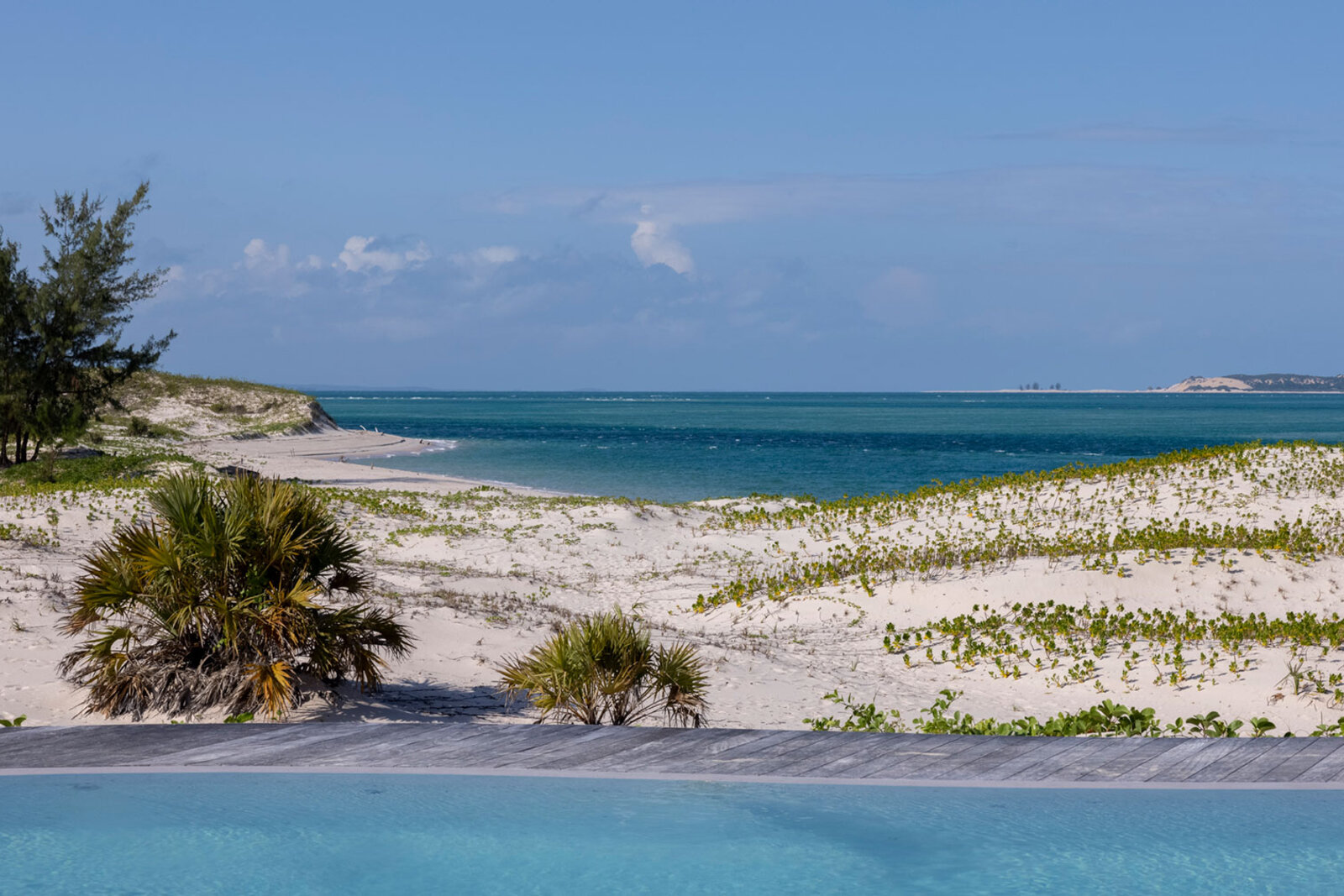 Empty white beach and dune with a turquoise lagoon on Benguerra Island at Kisawa Sanctuary, Mozambique