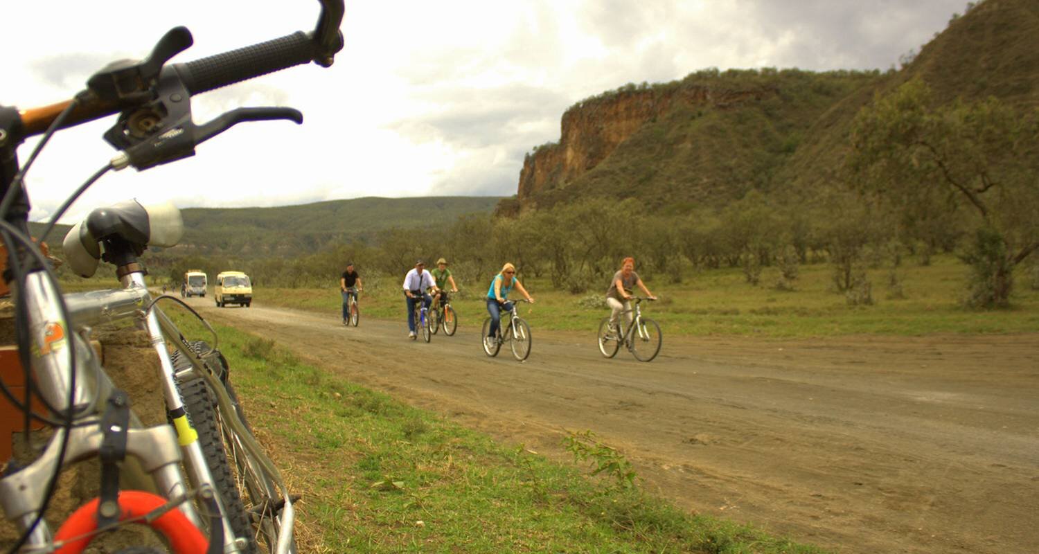 Cyclists among the cliffs and wildlife of Hell's Gate National Park