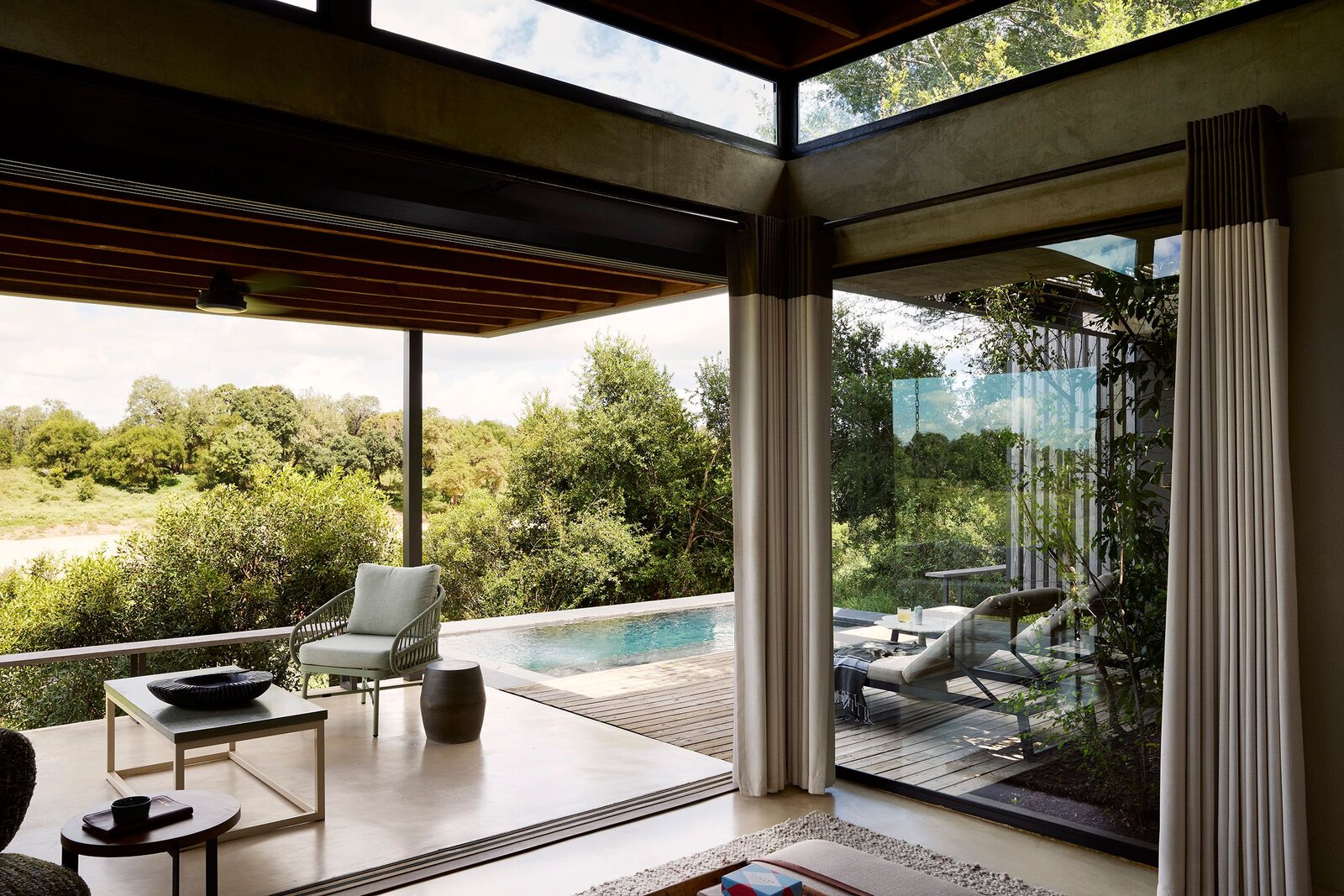 Lion Sands Ivory Lodge private plunge pool and lounge deck overlooking the bush