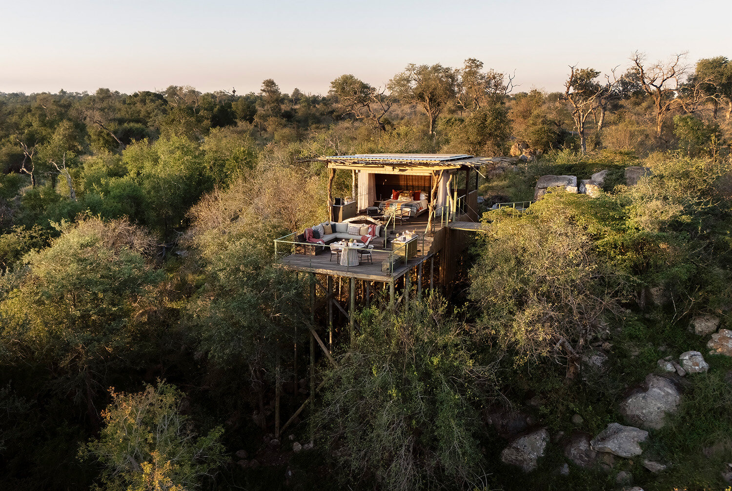 Lion Sands treehouse elevated above the bush canopy in the Sabi Sand