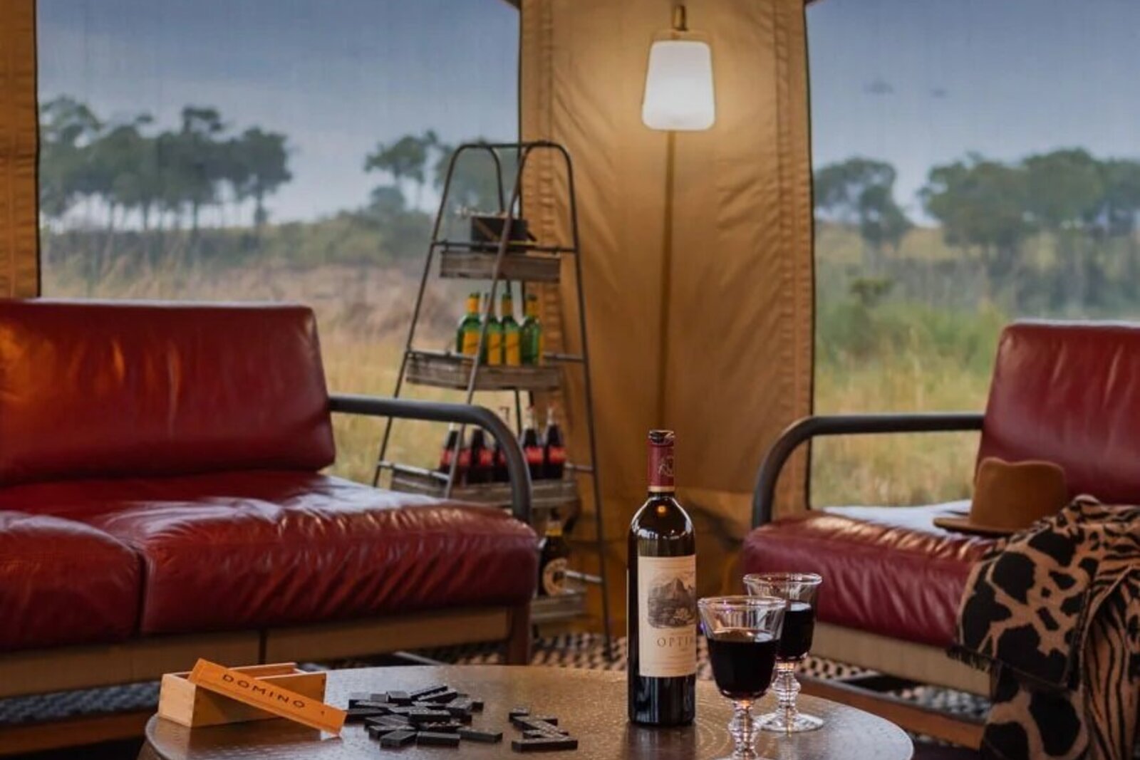 Luxury tented suite lounge with panoramic Masai Mara savannah views