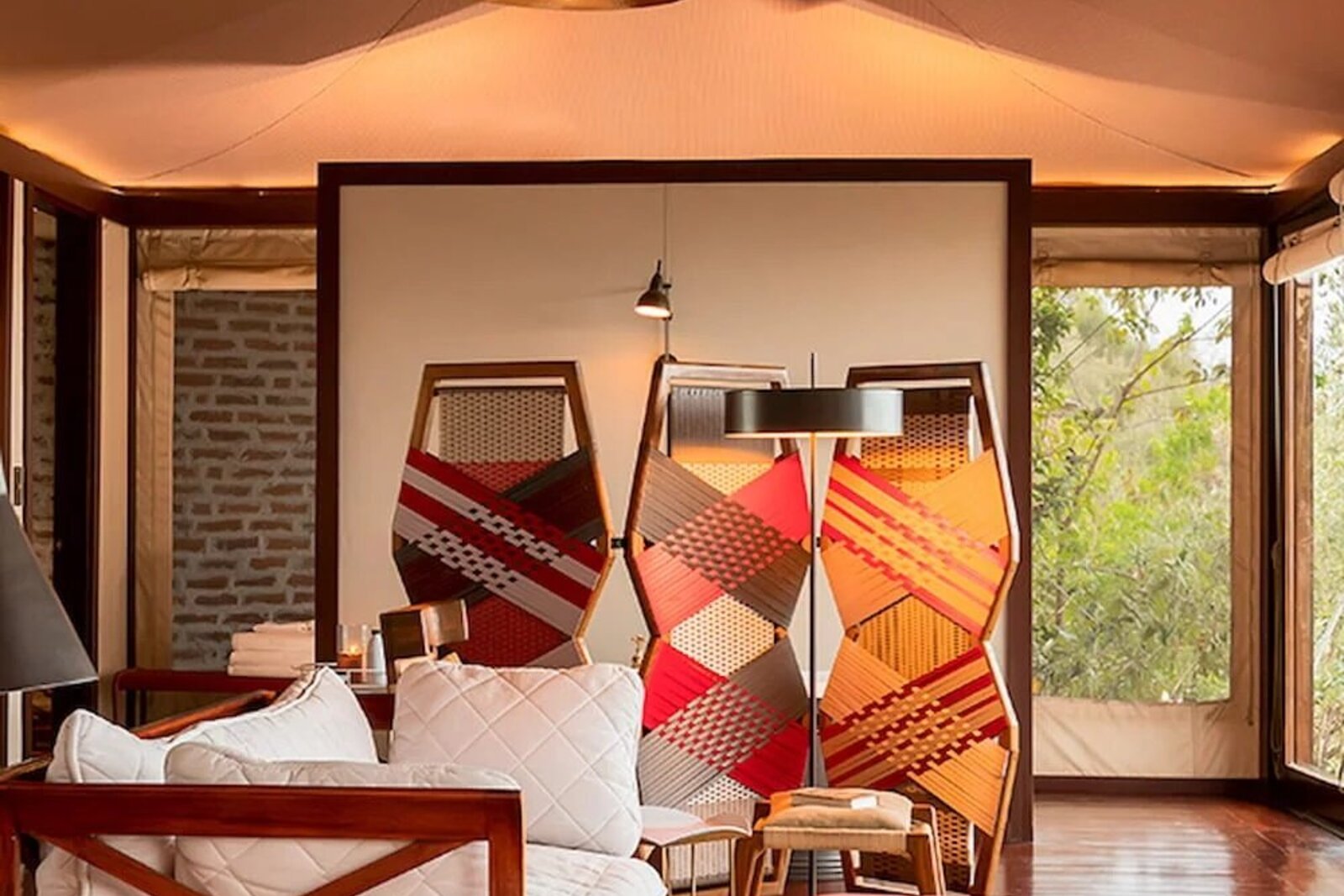 Elegant tented suite bedroom at a luxury Masai Mara camp