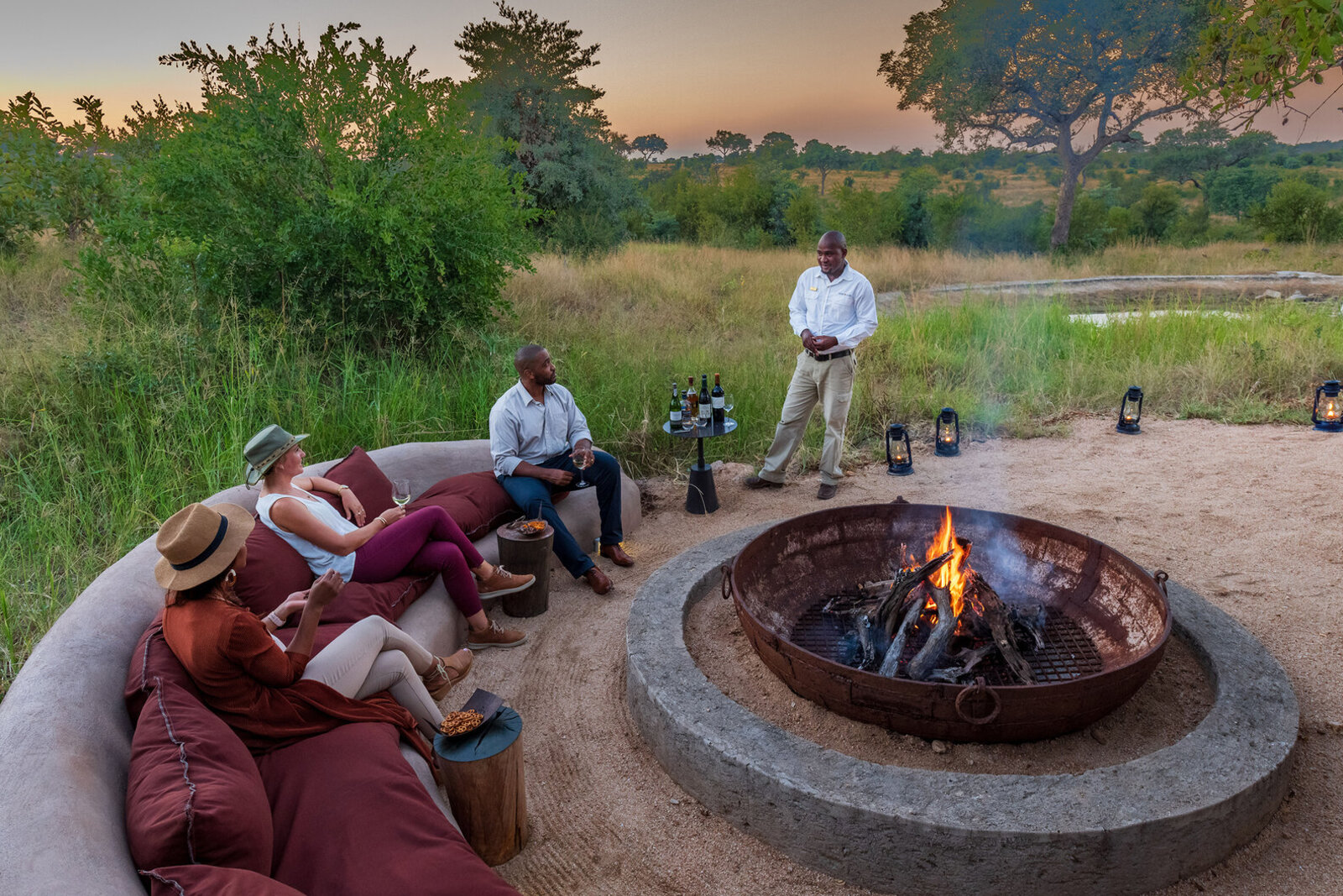 Boma fire pit dinner at sunset in the Sabi Sands