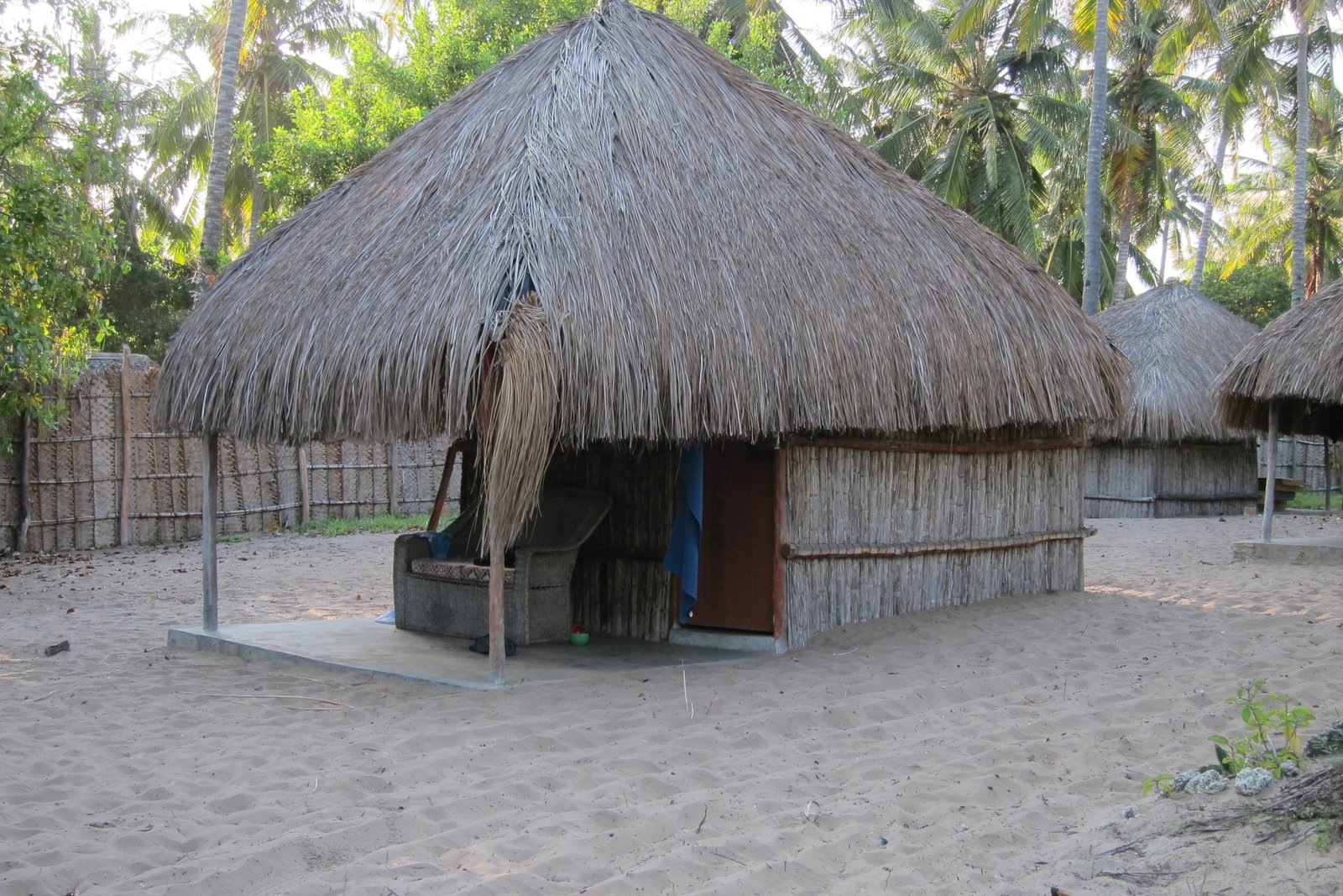 A thatched makuti beach banda on the sand along the East African coast
