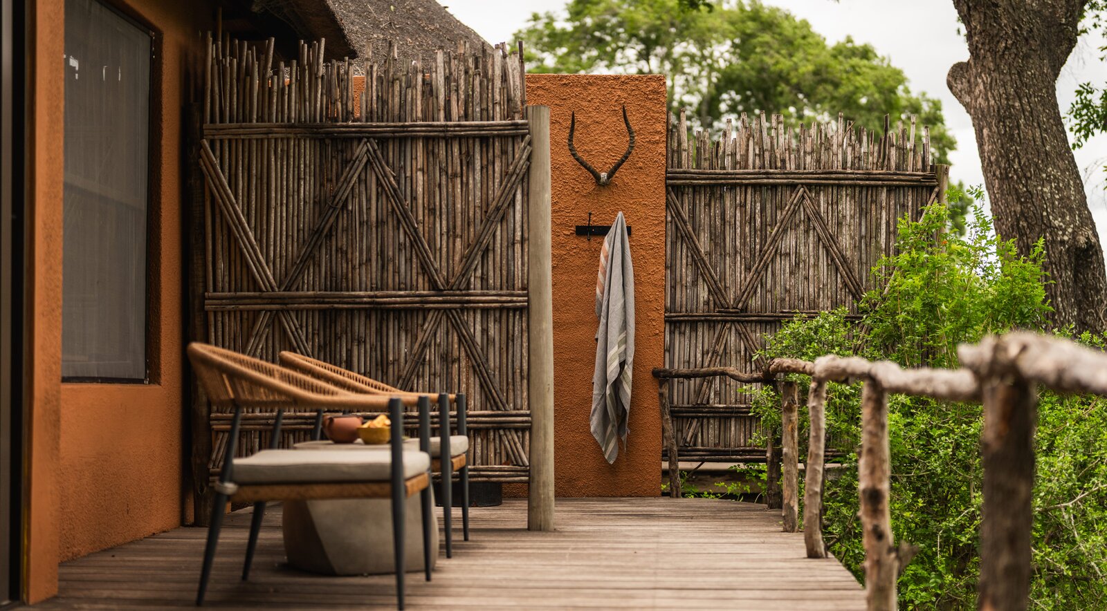 An outdoor shower on a private deck at MalaMala overlooking the bush