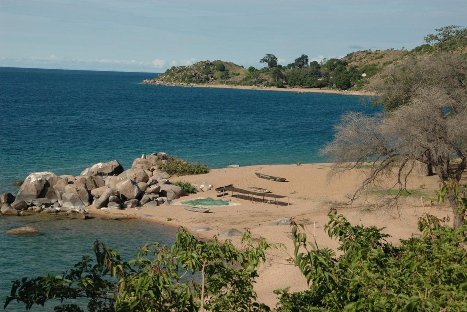 Clear water and a rocky shore on Lake Malawi