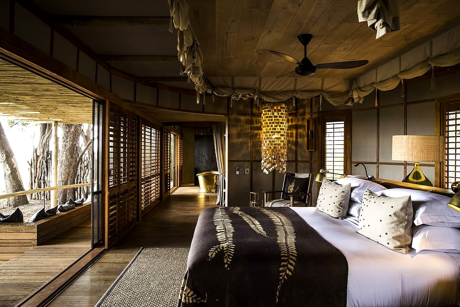 Mashatu Main Camp luxury tented suite with private deck overlooking the African bush