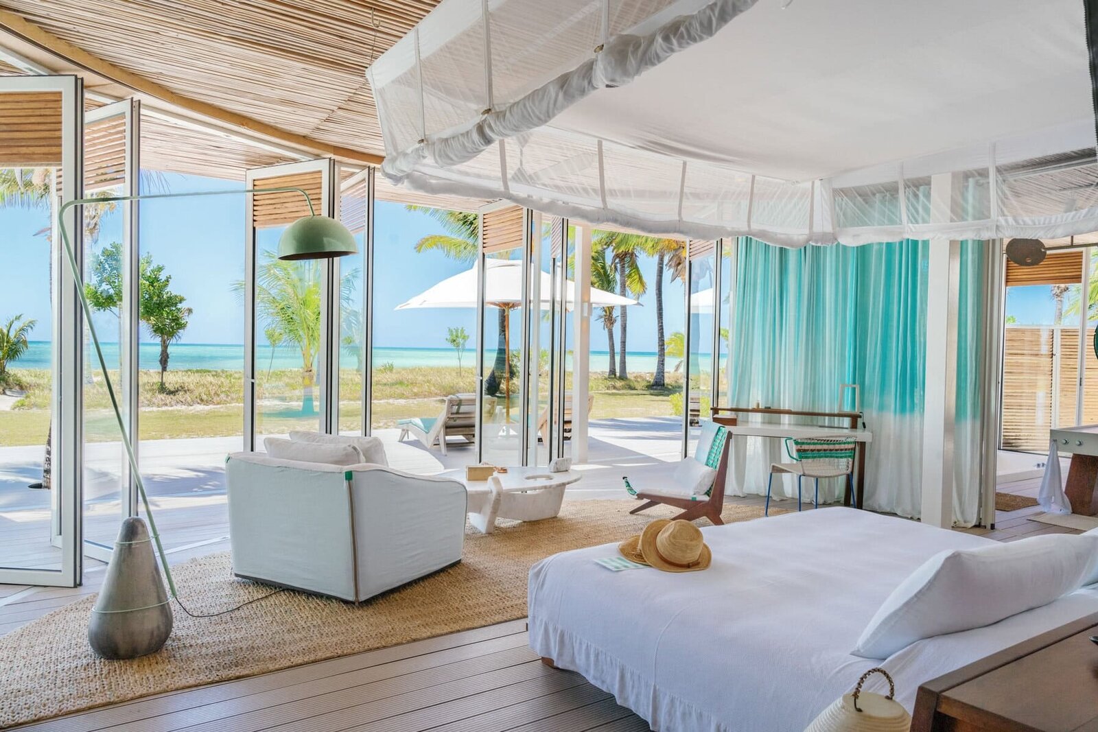 A light-filled ocean villa suite at Miavana on Nosy Ankao, northern Madagascar, opening to the beach and Indian Ocean