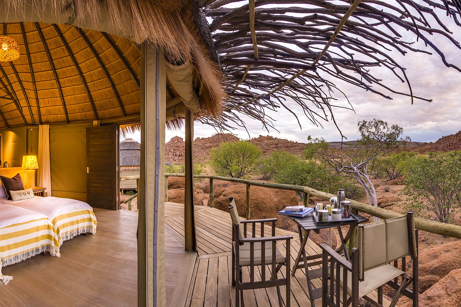 Thatched dining area and lounge surrounds at Mowani Mountain Camp, Damaraland