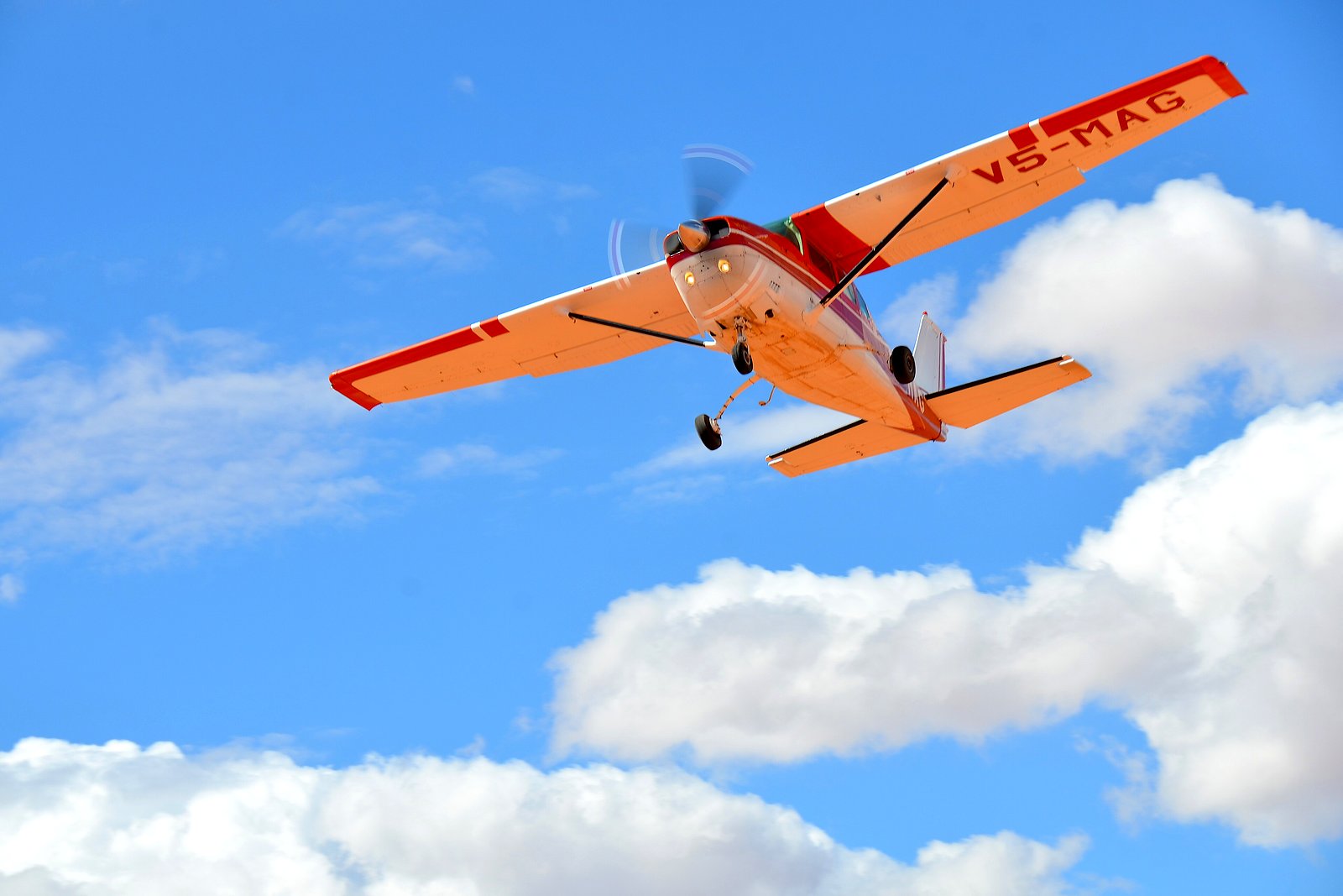 A light aircraft over the Namib dunes on an ultimate Namibia fly-in safari package