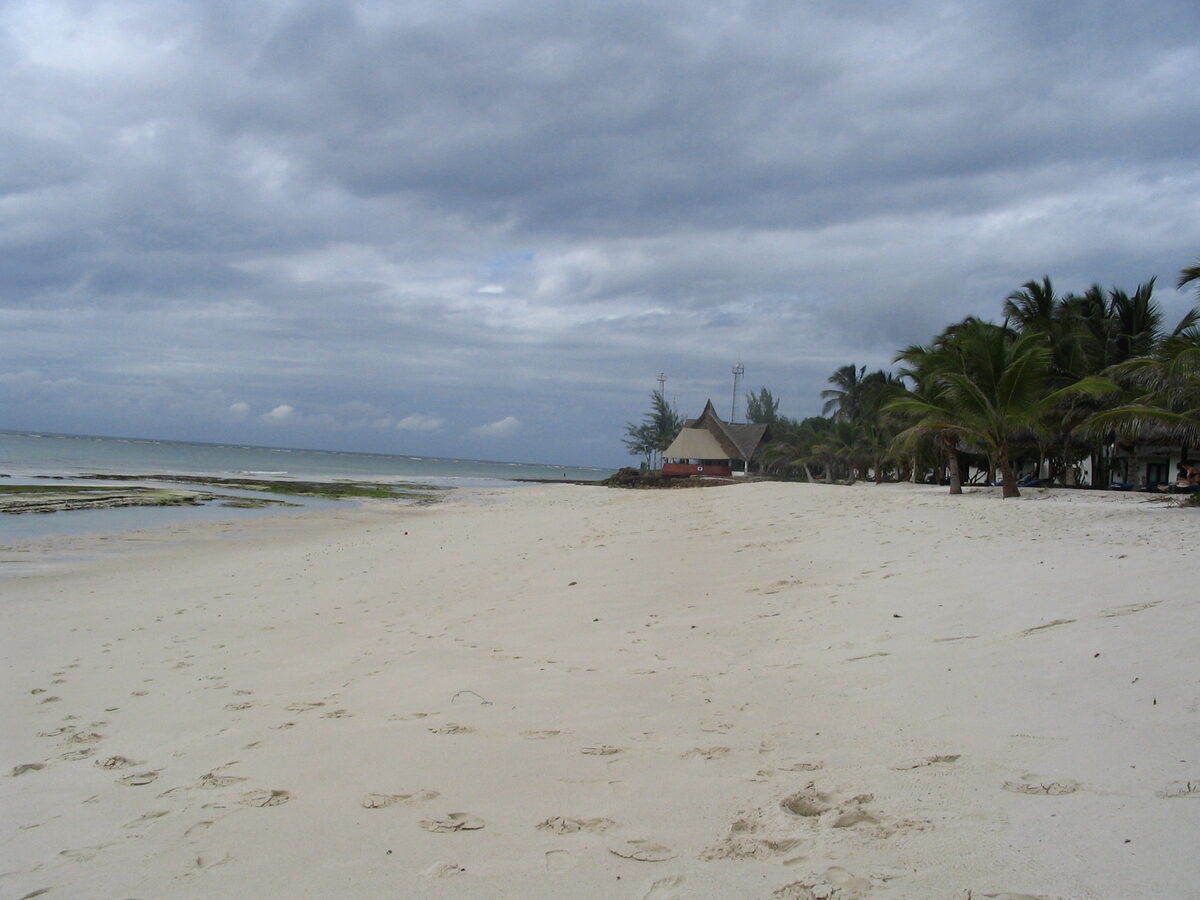 Diani Beach coastline looking south along white sand near Neptune Paradise Beach Resort Kenya