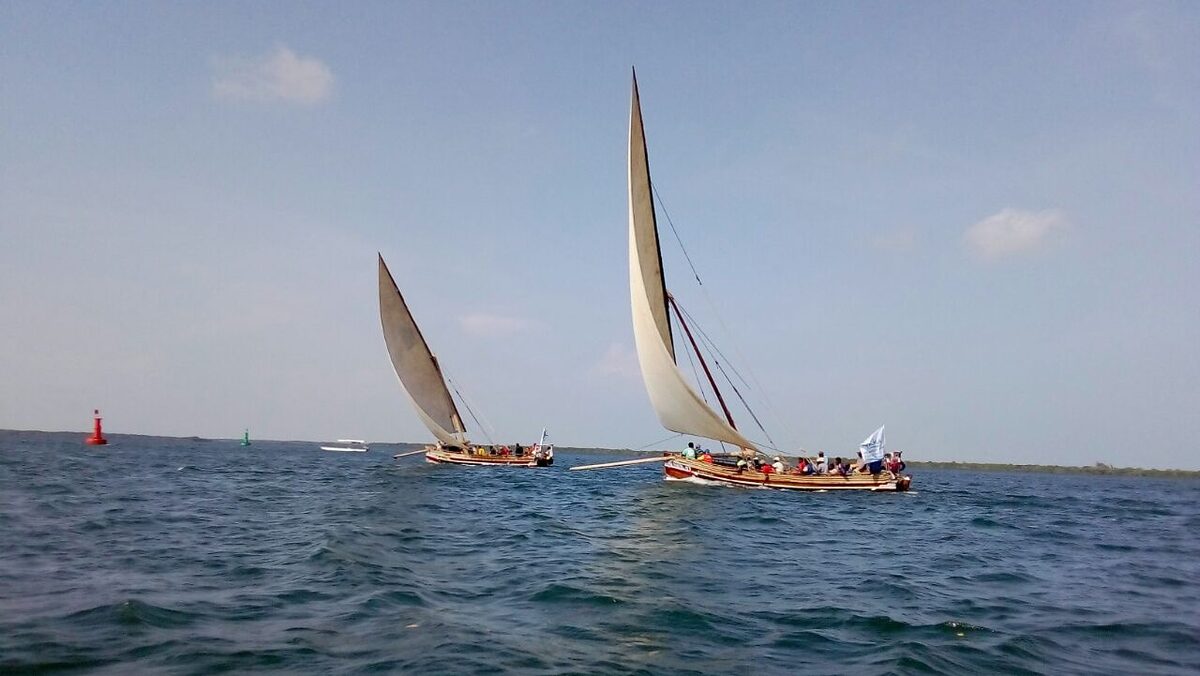 Traditional wooden dhow sailing off the Kenya coast near Diani Beach