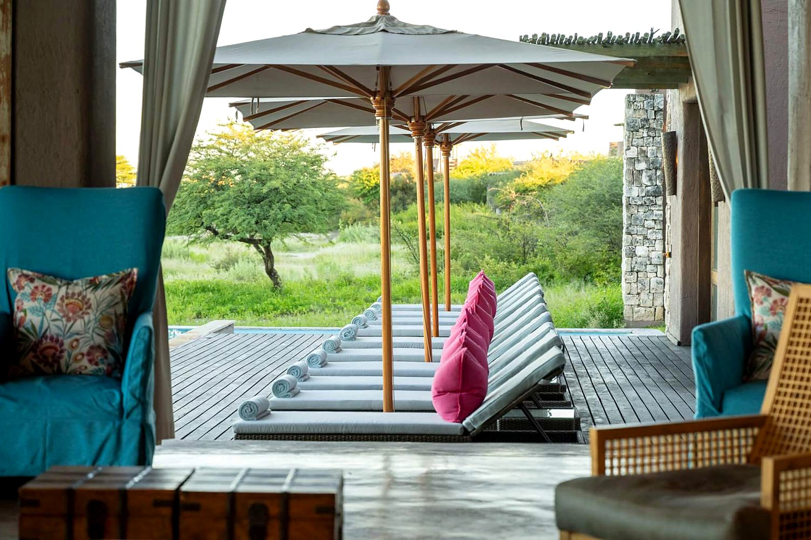Pool terrace and raised deck surrounds at Onguma The Fort overlooking the plains
