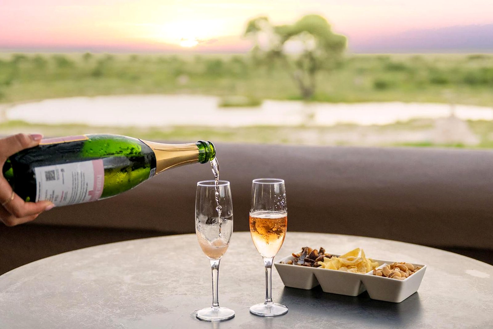 Champagne deck overlooking the private Onguma Reserve at Onguma The Fort