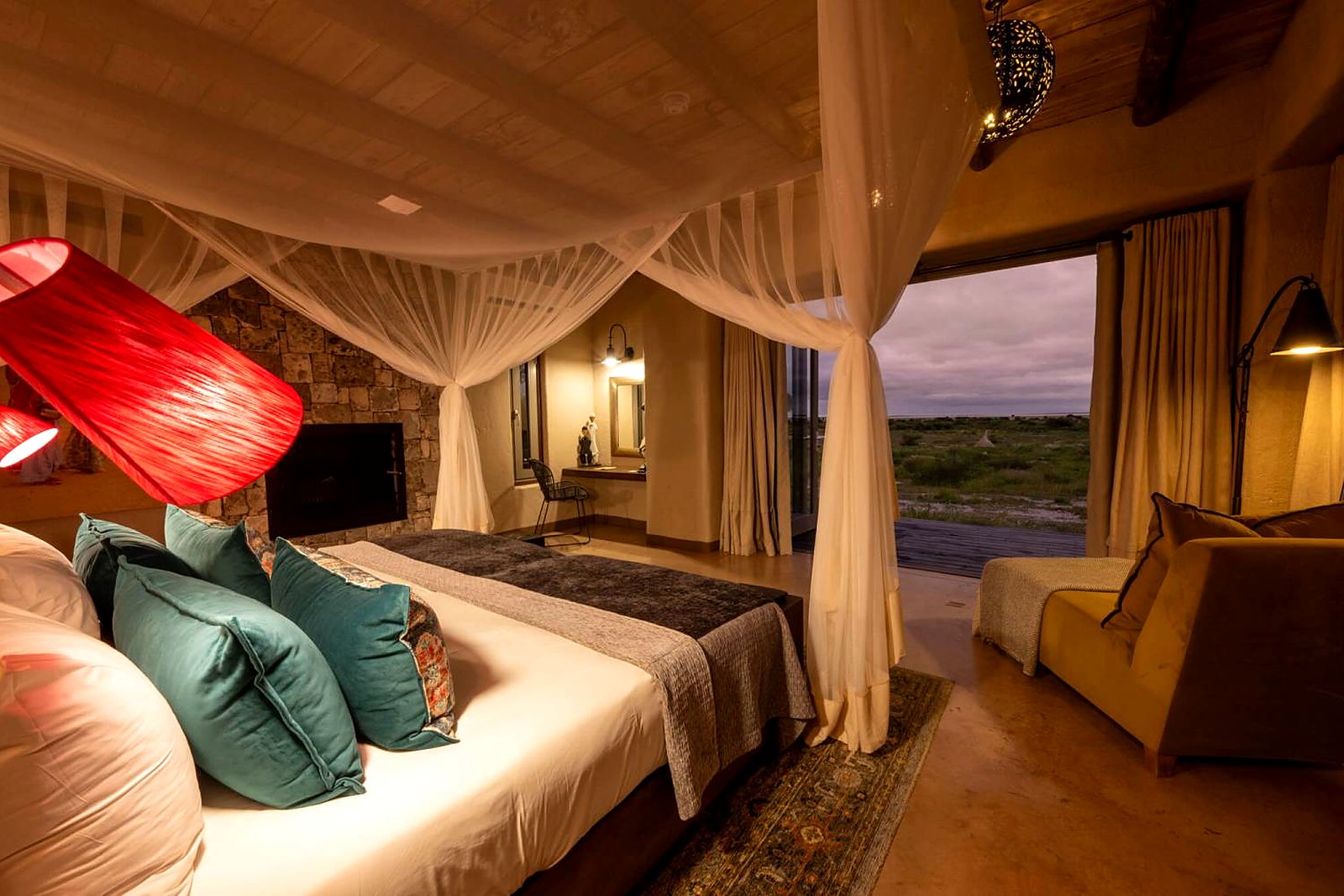Four-poster bed in a suite at Onguma The Fort, eastern Etosha