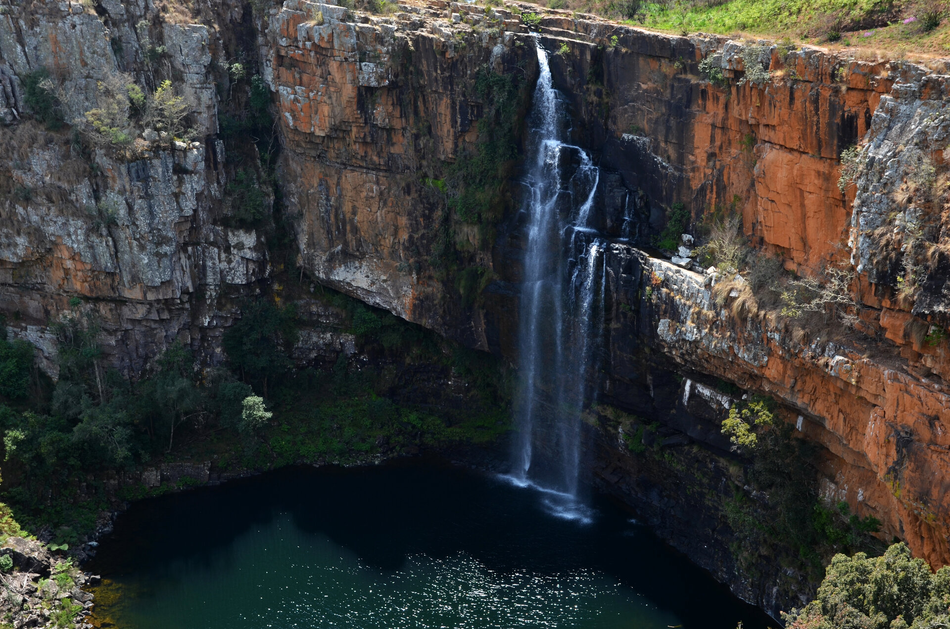 Berlin Falls plunging into a deep green pool on the Panorama Route