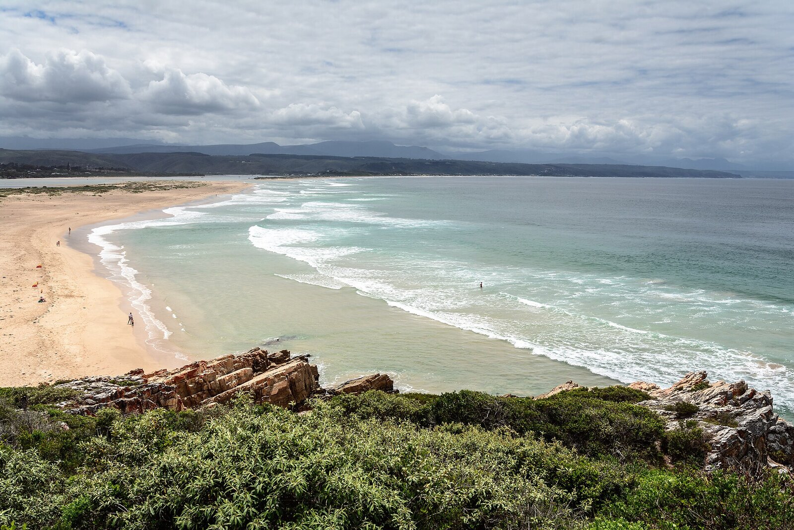 Golden-hour light over Lookout Beach and the Keurbooms river mouth at Plettenberg Bay
