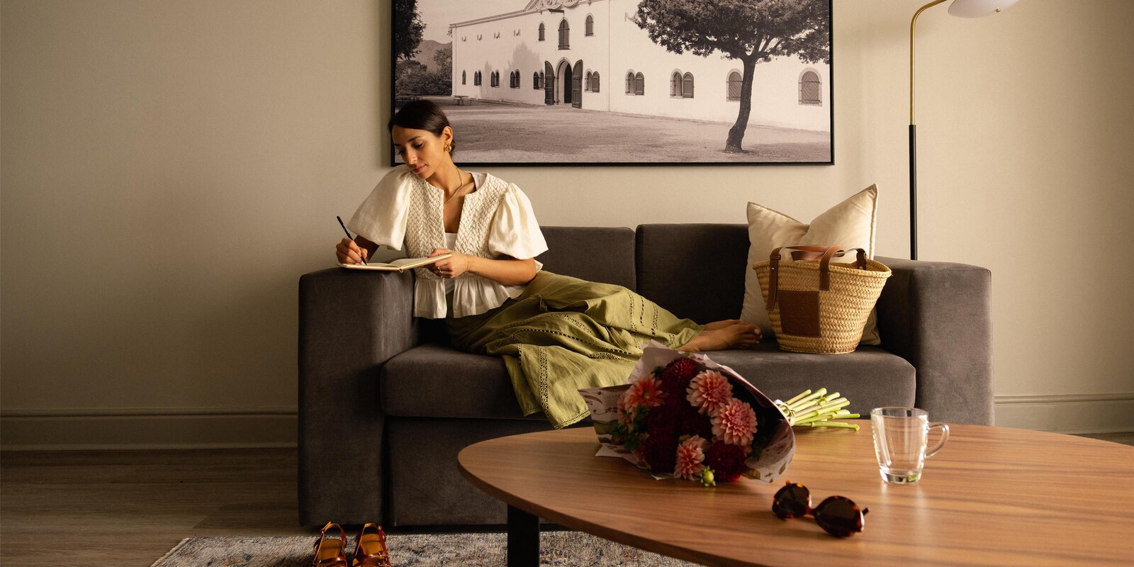 A suite living area at the Radisson Collection Waterfront with soft seating and contemporary art
