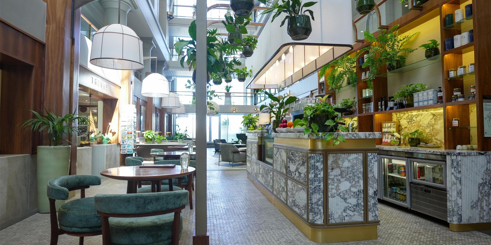 The Waveside Café at the Radisson Collection Waterfront, marble counter and plants