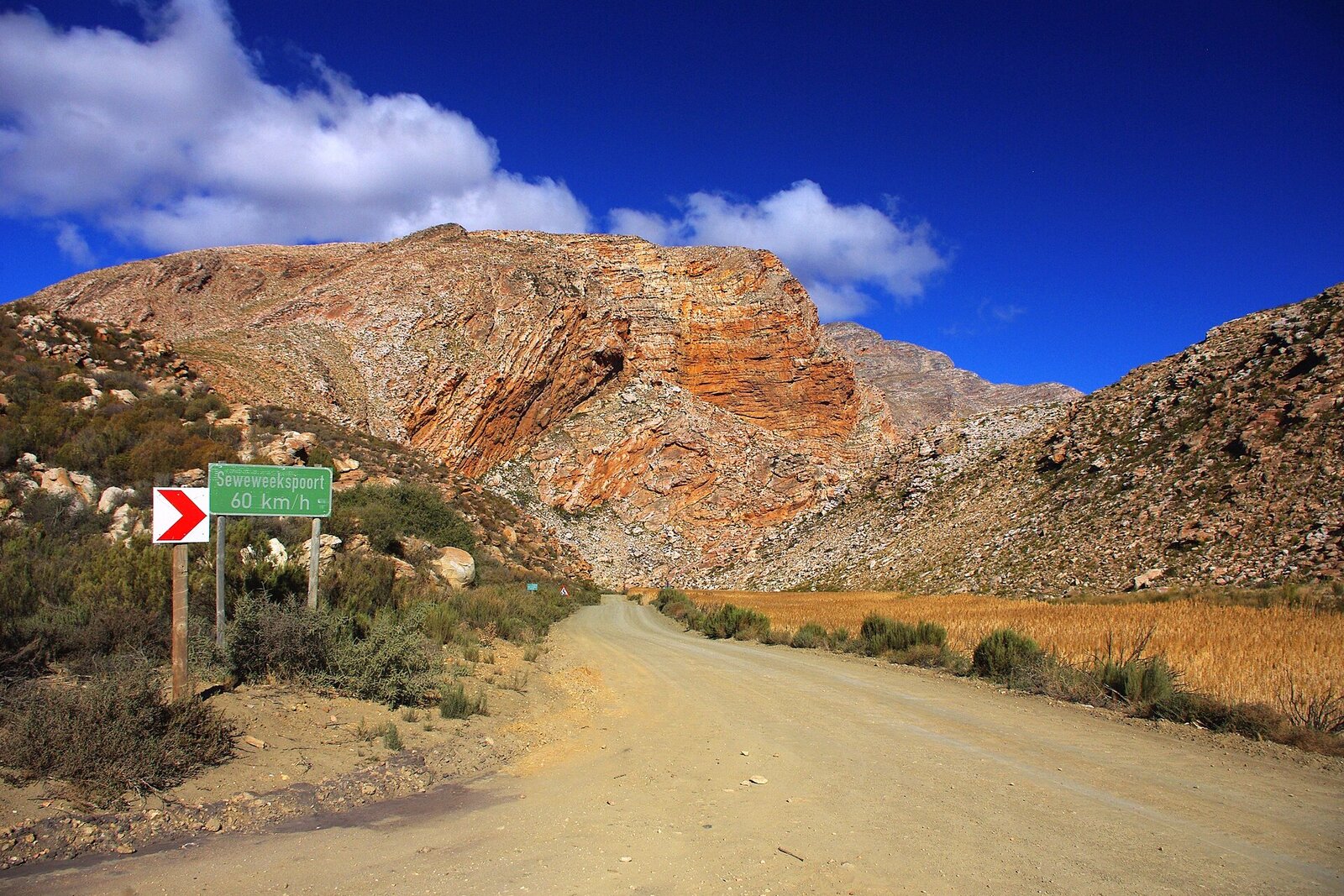 The winding Route 62 road through the Klein Karoo mountains at golden hour