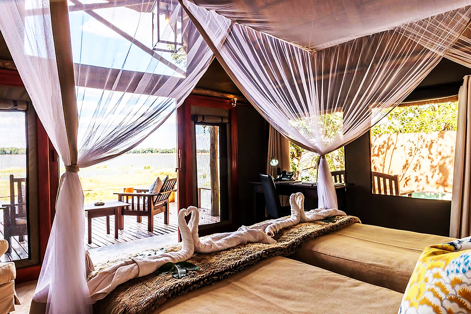 A canopy-bed tented suite open to the Lower Zambezi