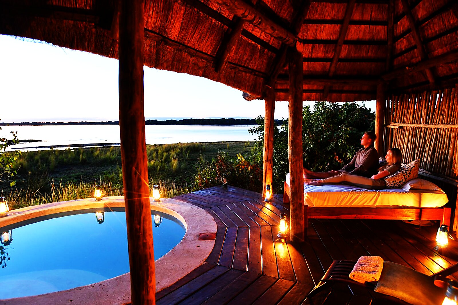 A thatched sala with a plunge pool above the Zambezi River